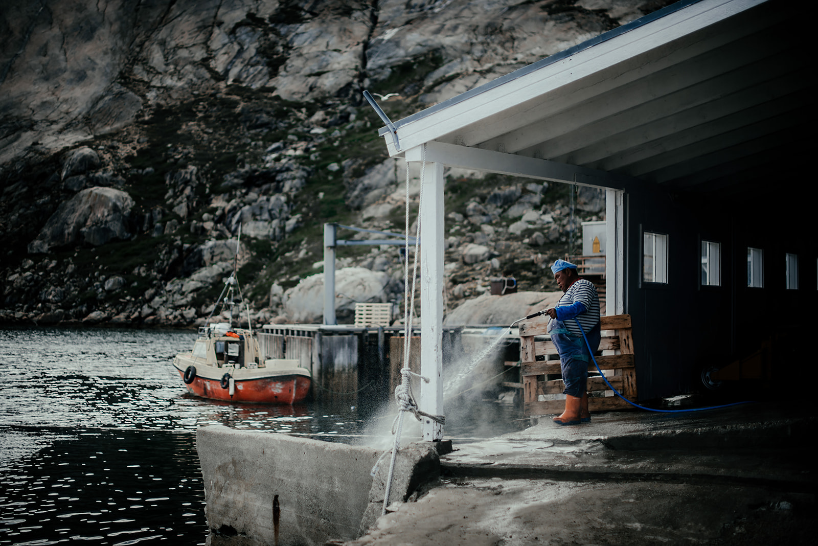 fisherman cleaning ground on Greenland
