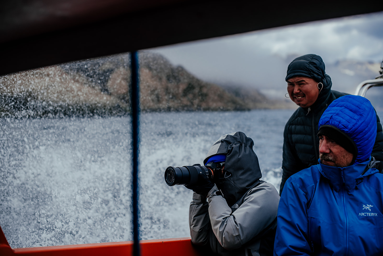 photographer on boat on Greenland