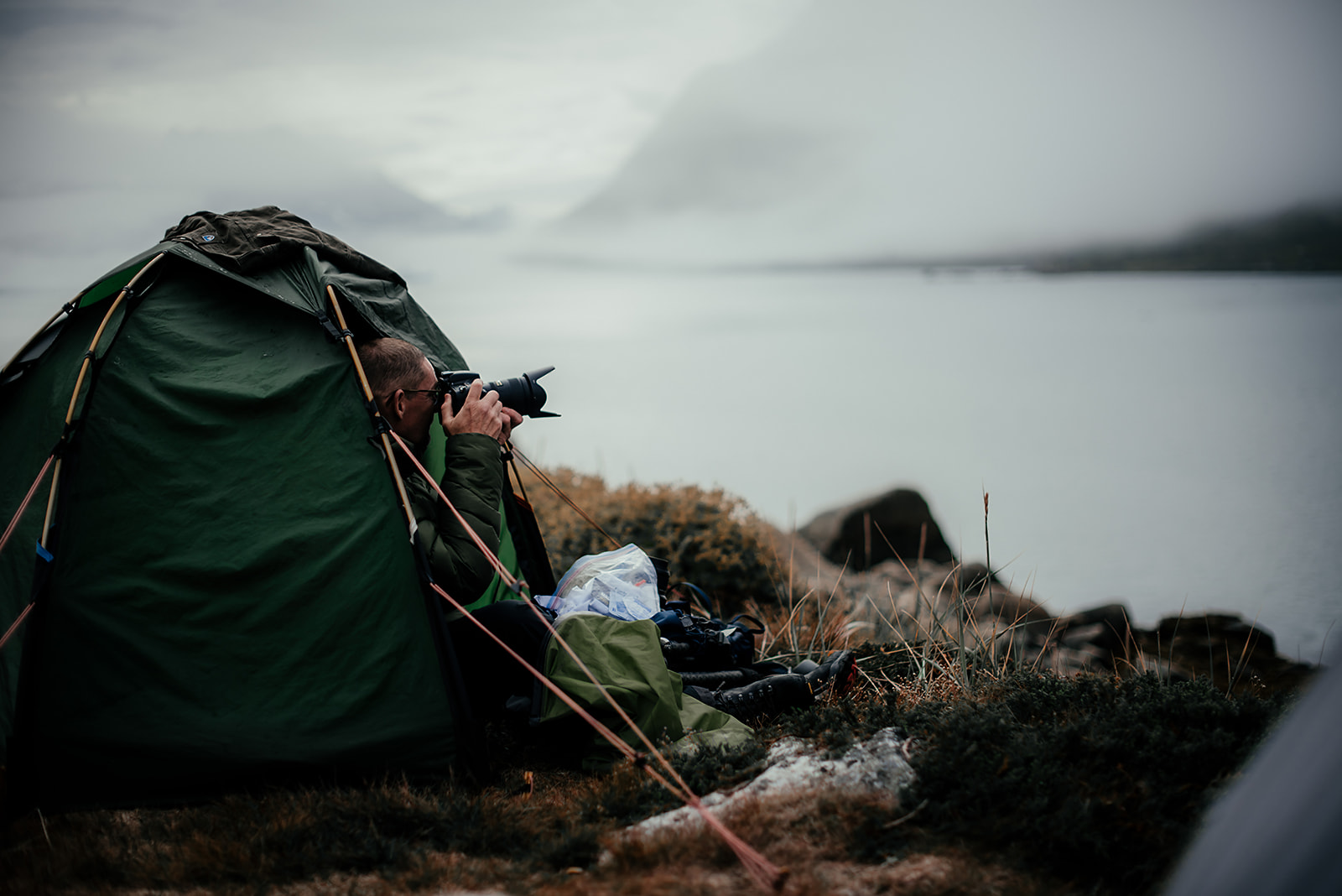 photographer shooting out of tent on Greenland