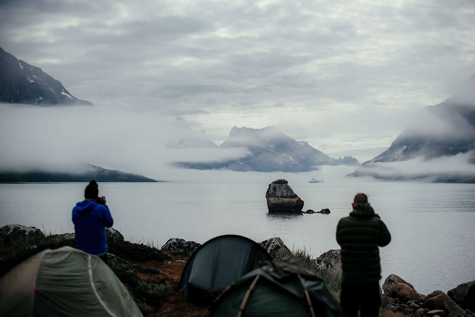 photographers shooting misty bay on Greenland