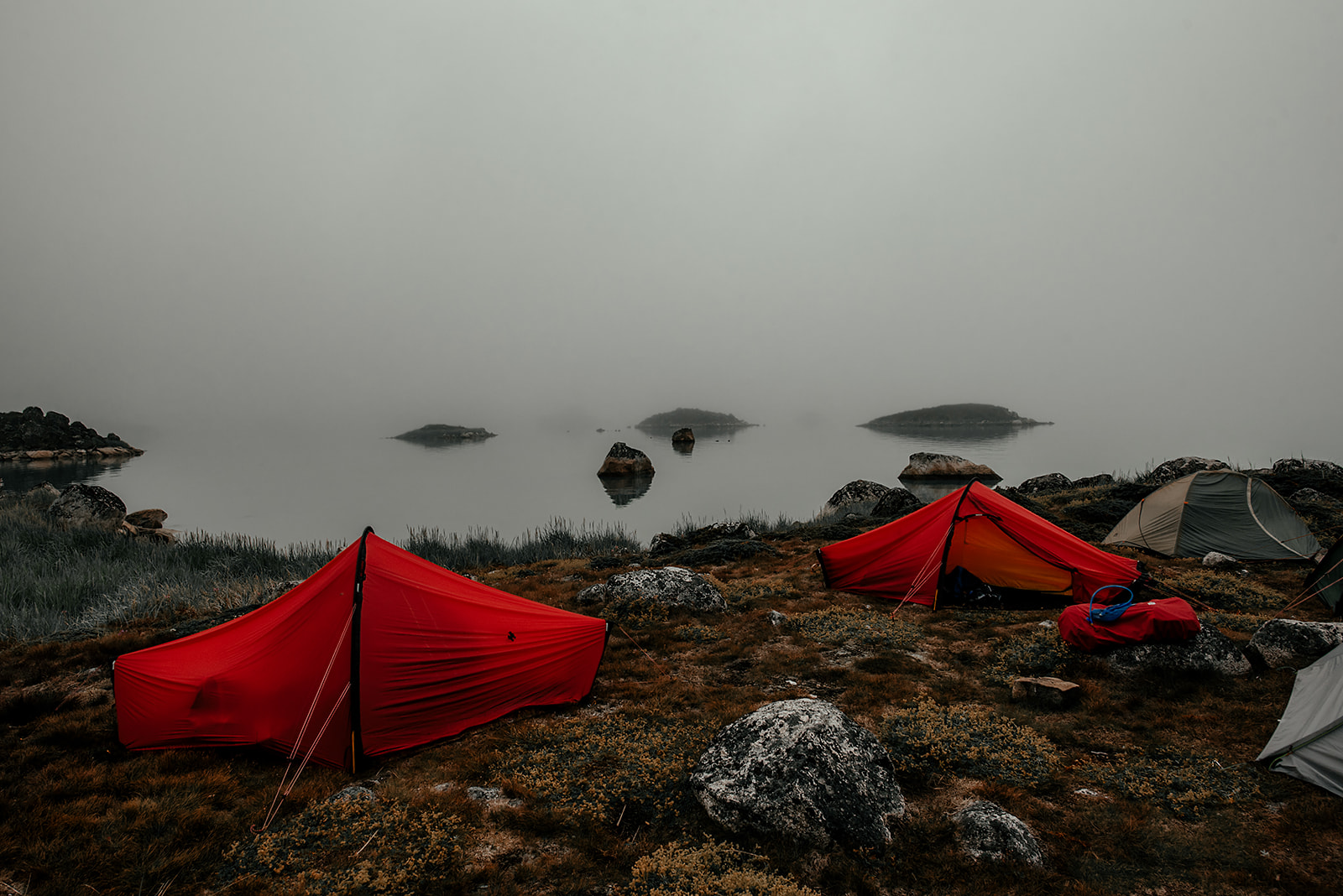 red tents at shore on Greenland