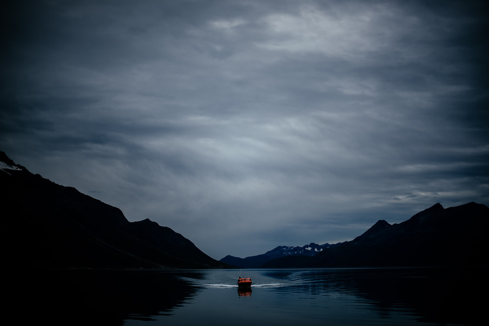 small boat in a fjord on Greenland