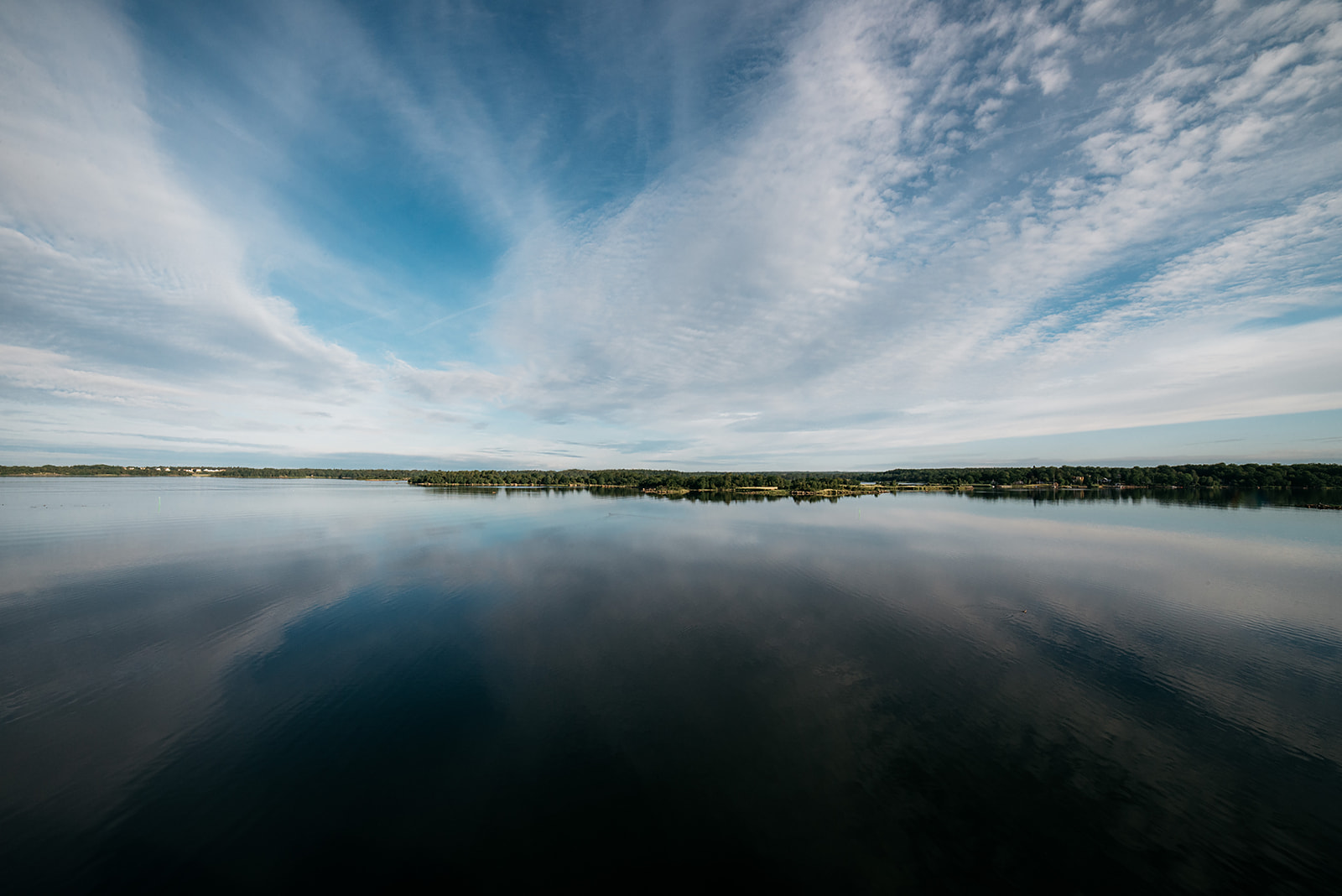 mirroring water around a small archipelago in Sweden