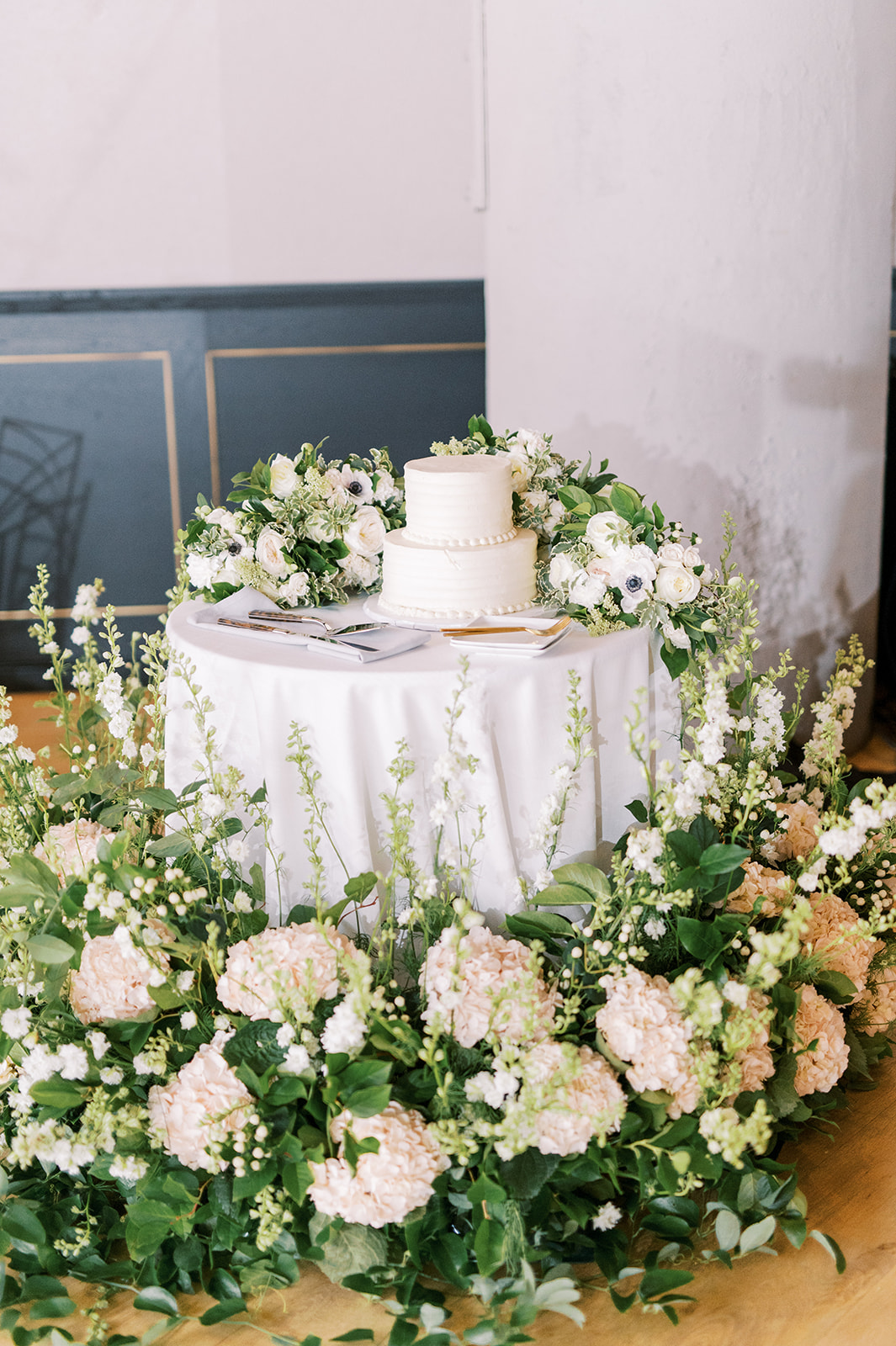lush wedding cake installation with full white blooms for Secret Urban Garden Wedding at Philadelphia’s Fitler Club