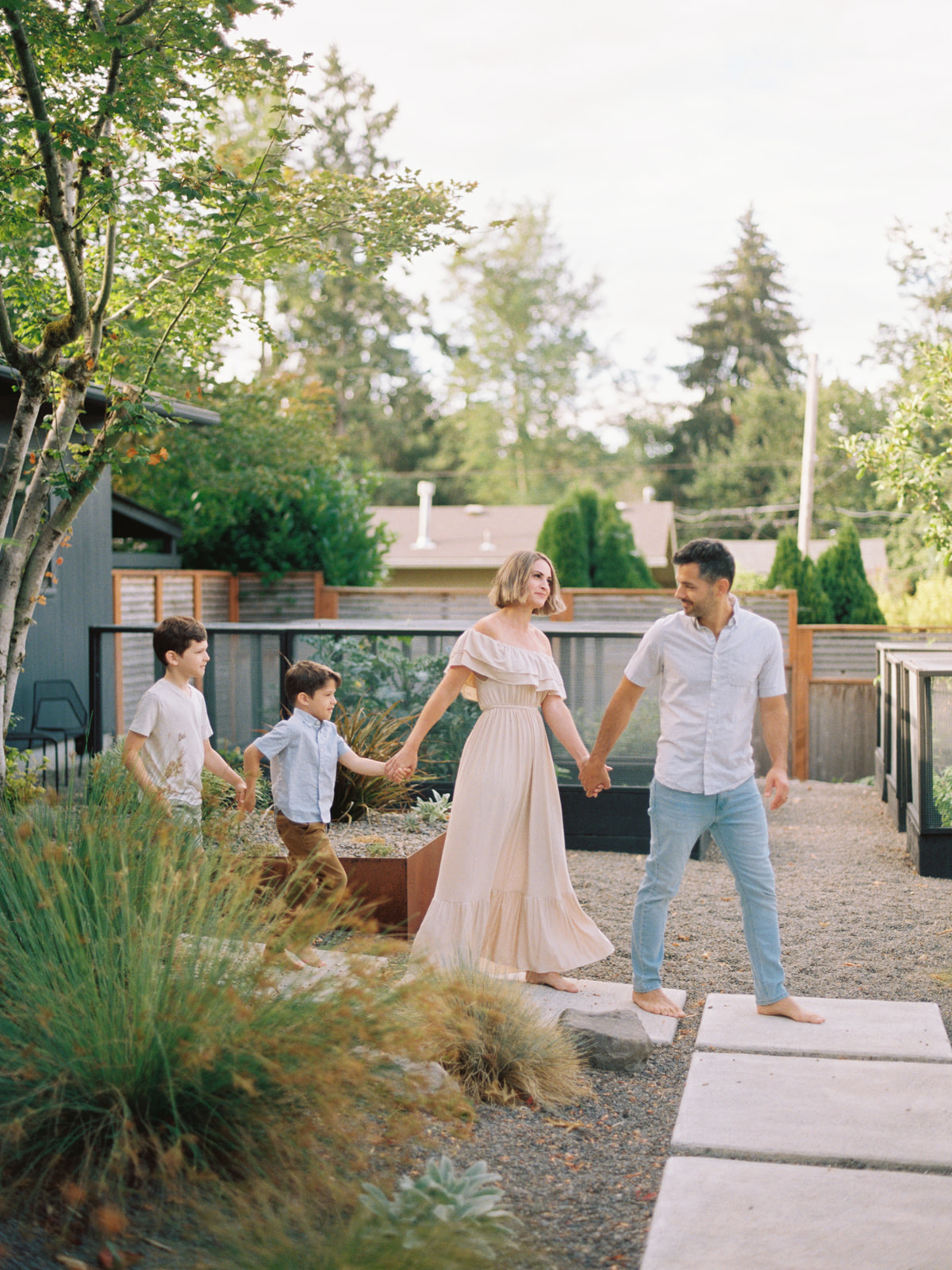 family walking in front of their home in West Linn, Oregon