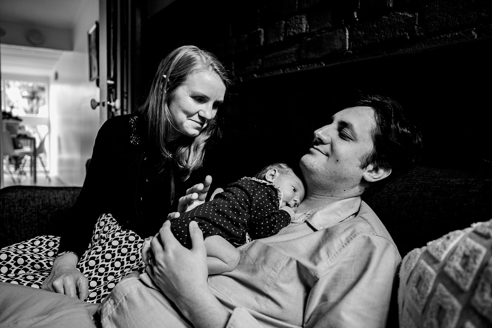newborn baby laying of fathers chest during family portrait session