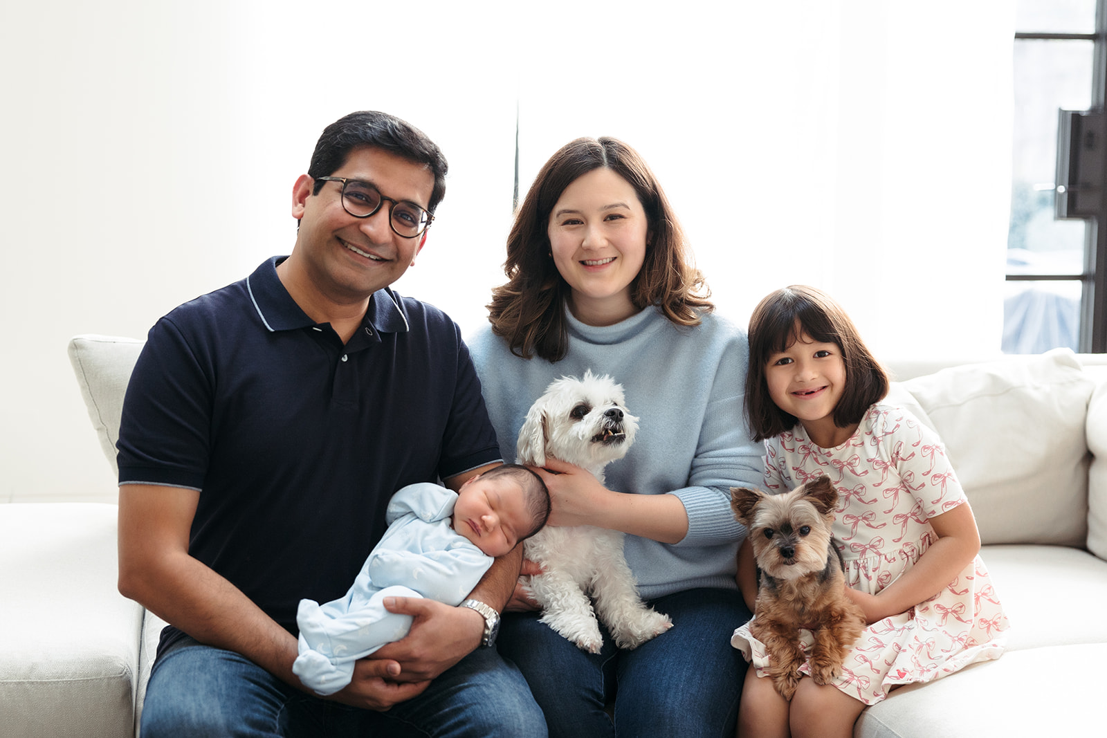 Beautiful family of four and their dogs for newborn photoshoot