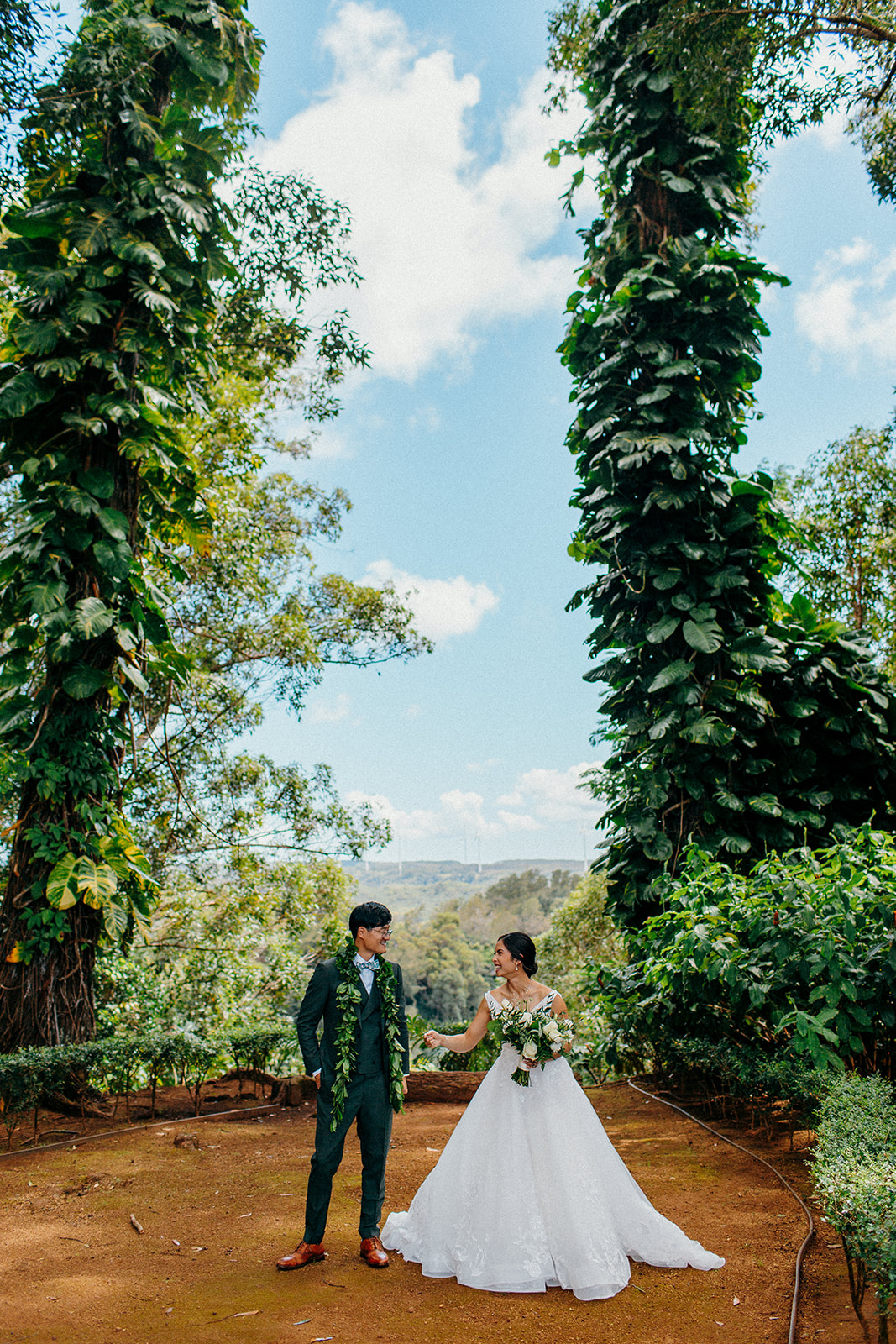 Epic and beautiful wedding portraits on top of Waimea Bay at Hawaii's Sunset Ranch