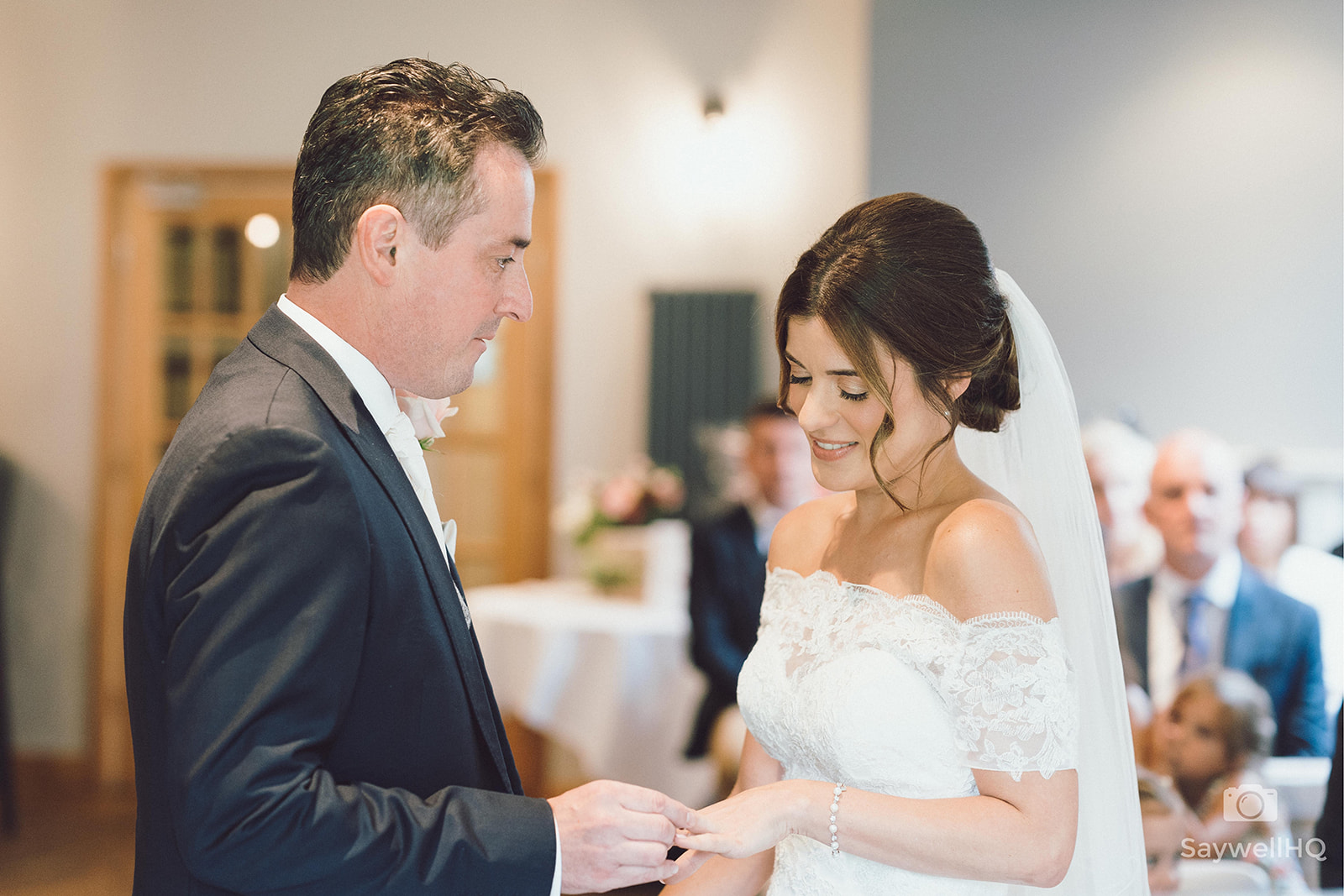 The Chequers Inn Wedding Photography - bride and groom, exchanging wedding rings during the wedding ceremony