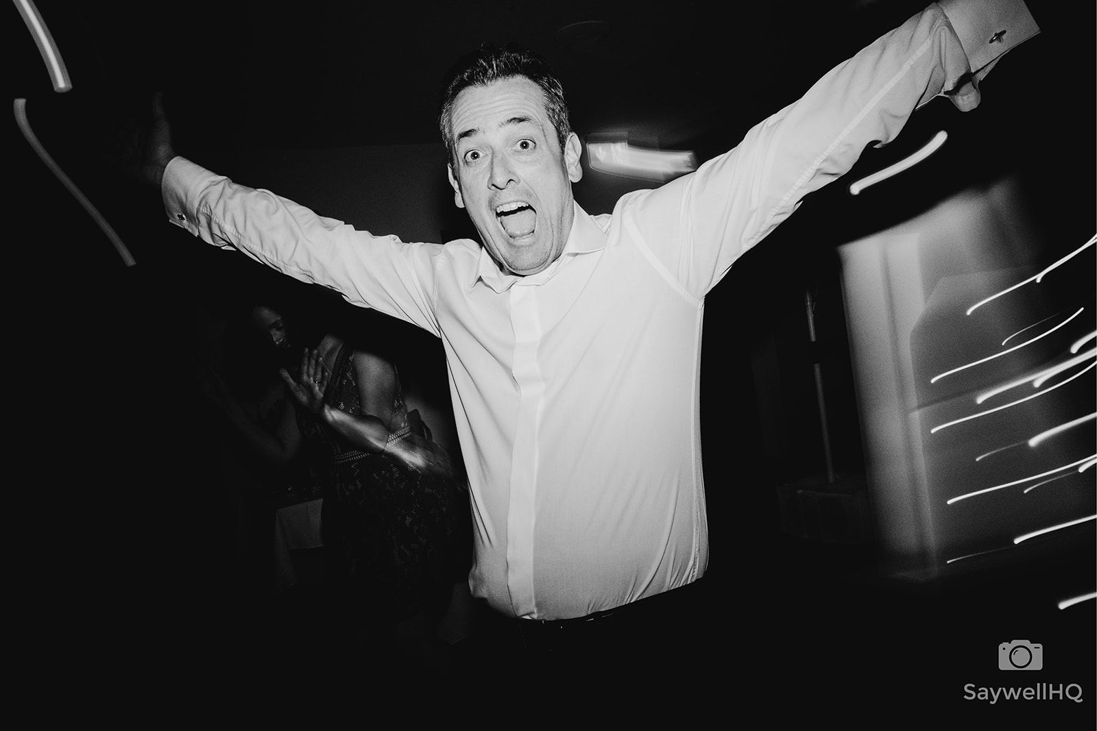 The Chequers Inn Wedding Photography - the groom dancing to the music being played by the wedding DJ