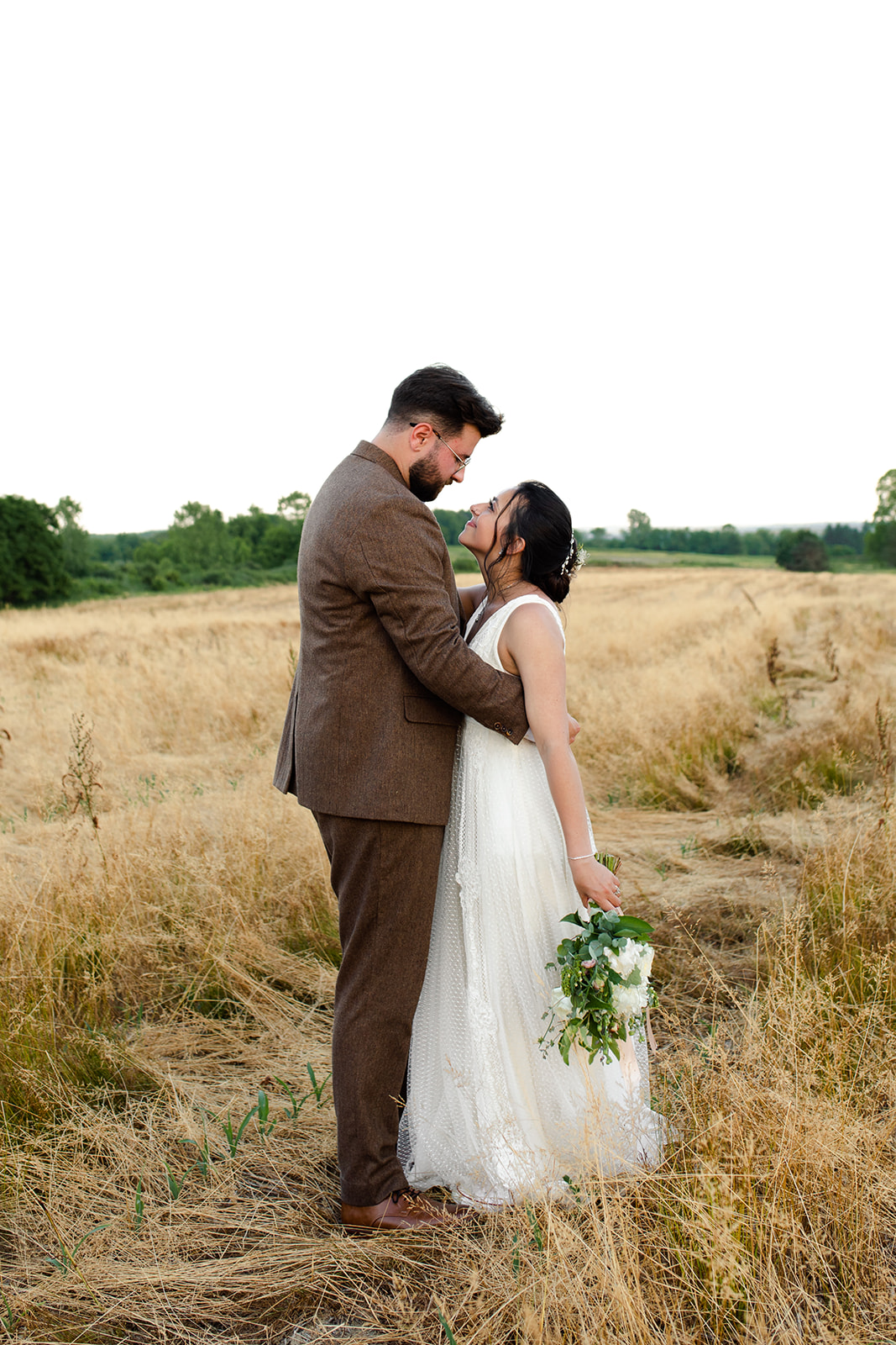 Majestic wedding photos in a wheat field during a beautiful Ohio sunset