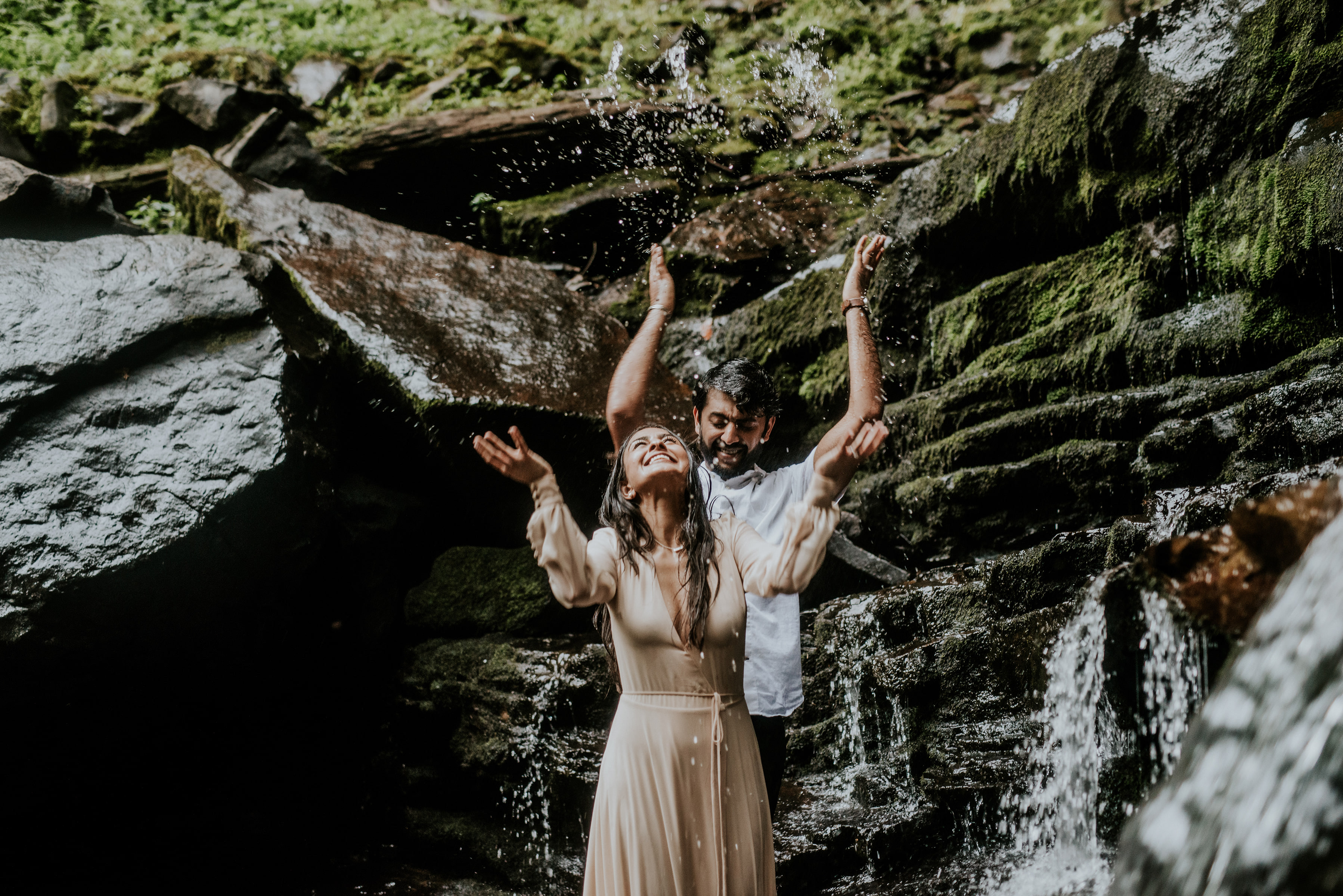 couple standing under a waterfall at cloudland canyon state park georgia