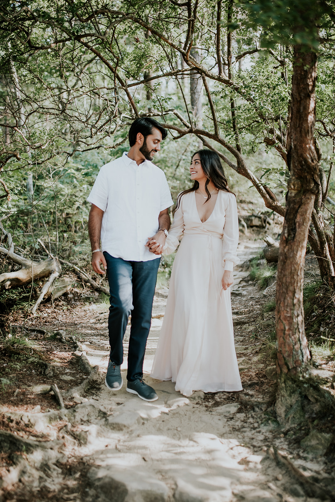 couple holding hands in cloudland canyon