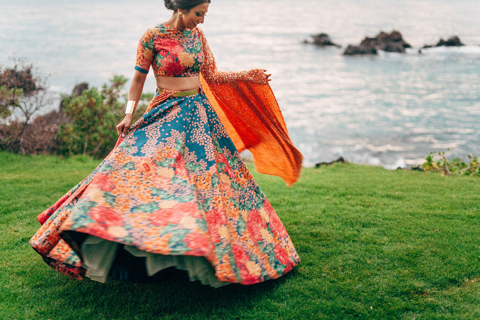 Bride twirling in her colorful custom Indian wedding dress in South Maui