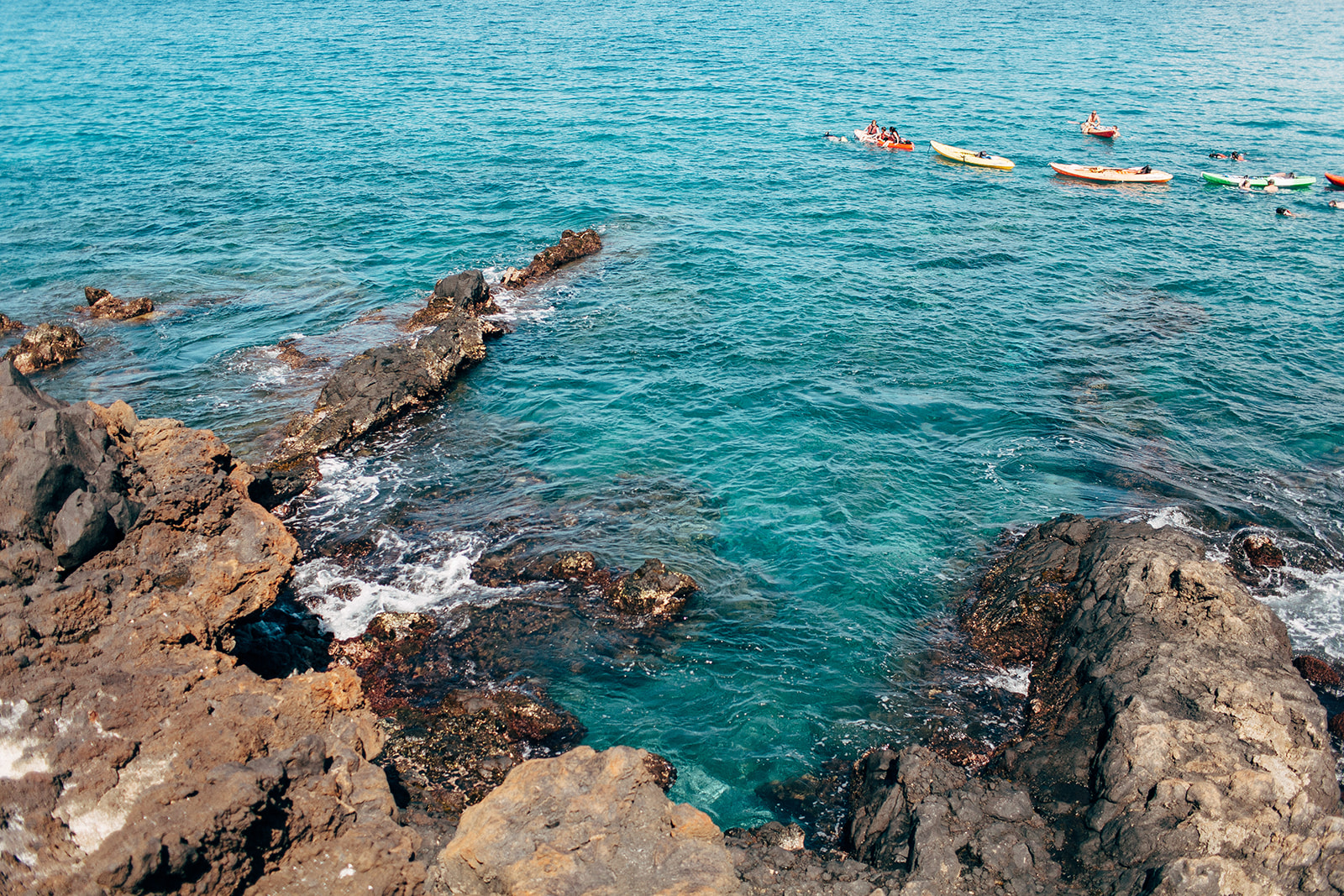 Kayaks on the crystal clear blue waters of south Maui