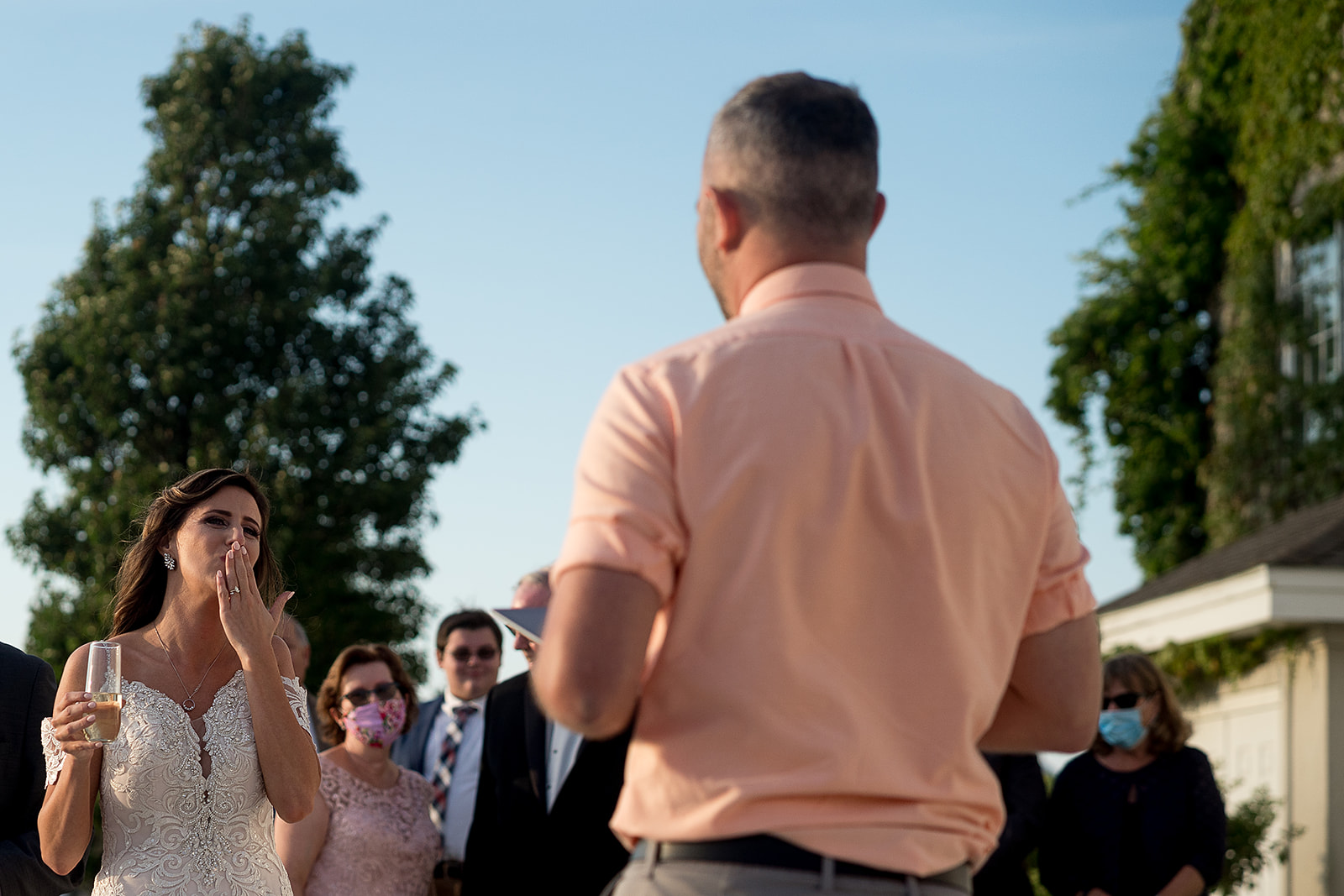 bride blowing friend a kiss during toasts at Belle Mer in Newport Rhode Island