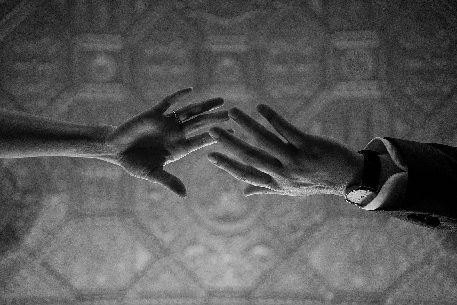 bride and groom hands reaching for each other at graduate hotel in Providence Rhode Island 