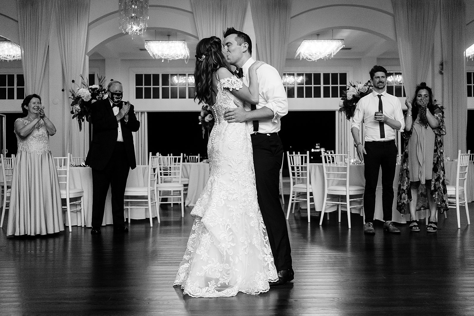 bride and groom kiss on the dance floor during belle mer wedding reception 