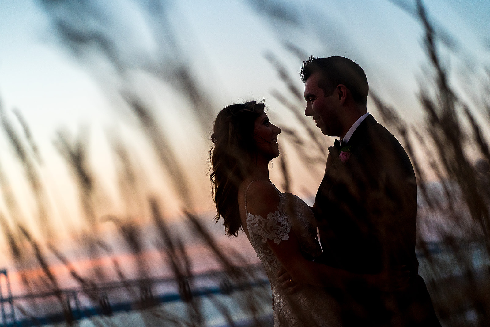 silhouette portrait of bride and groom with beach grass at Belle Mer in Newport Rhode Island