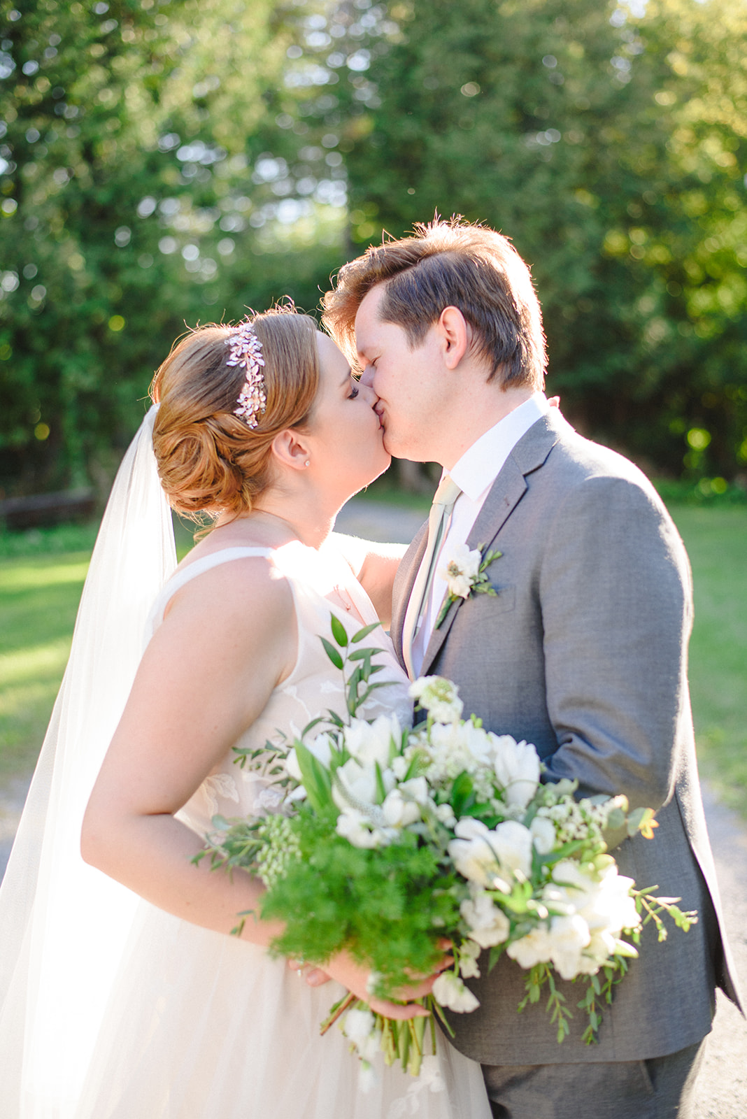 Bride and groom kissing after getting married at the Whitchurch Stouffville Museum 