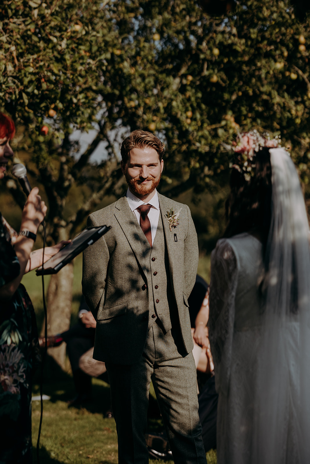 outdoor hand-fasting ceremony in an orchard