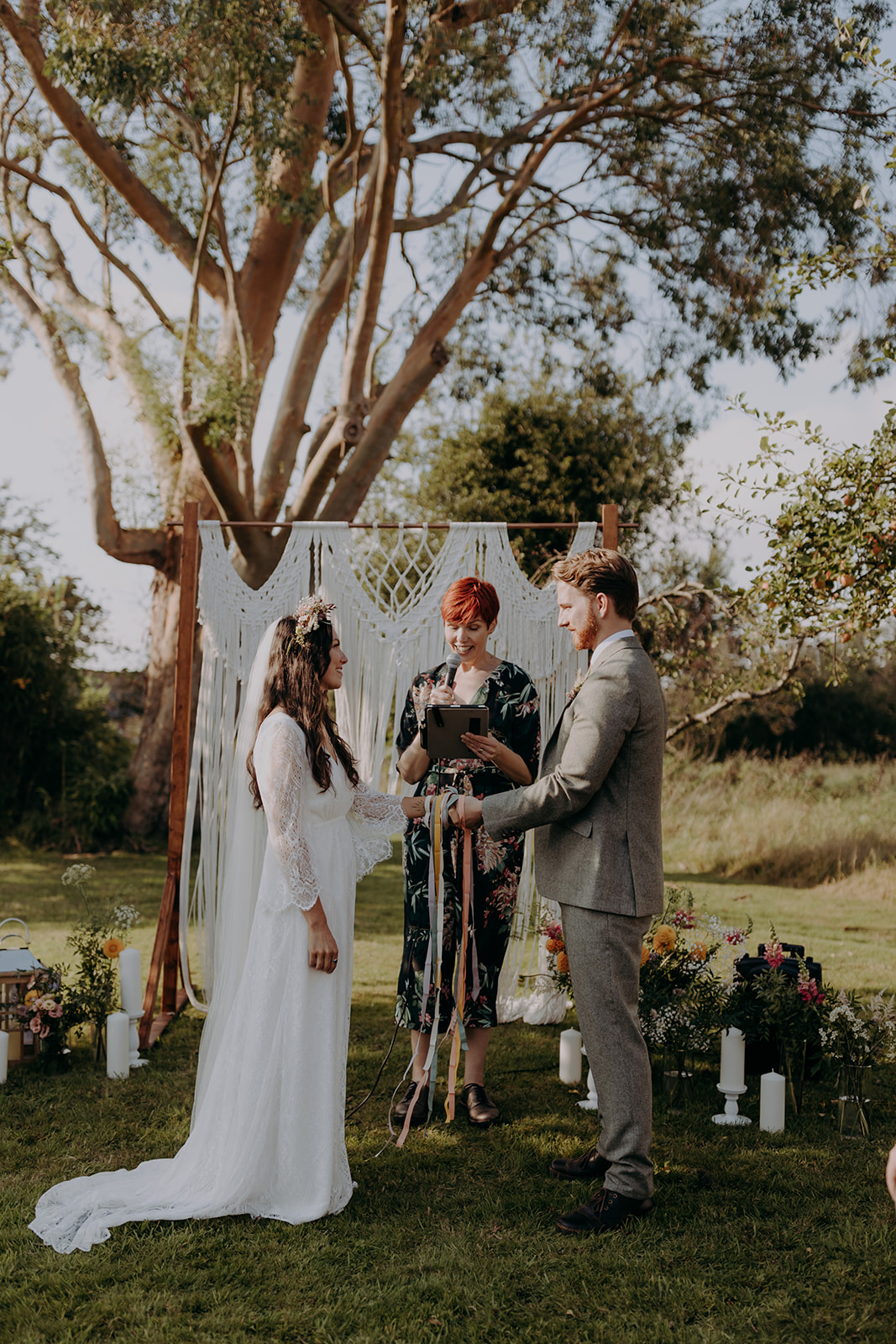 outdoor hand-fasting ceremony in an orchard