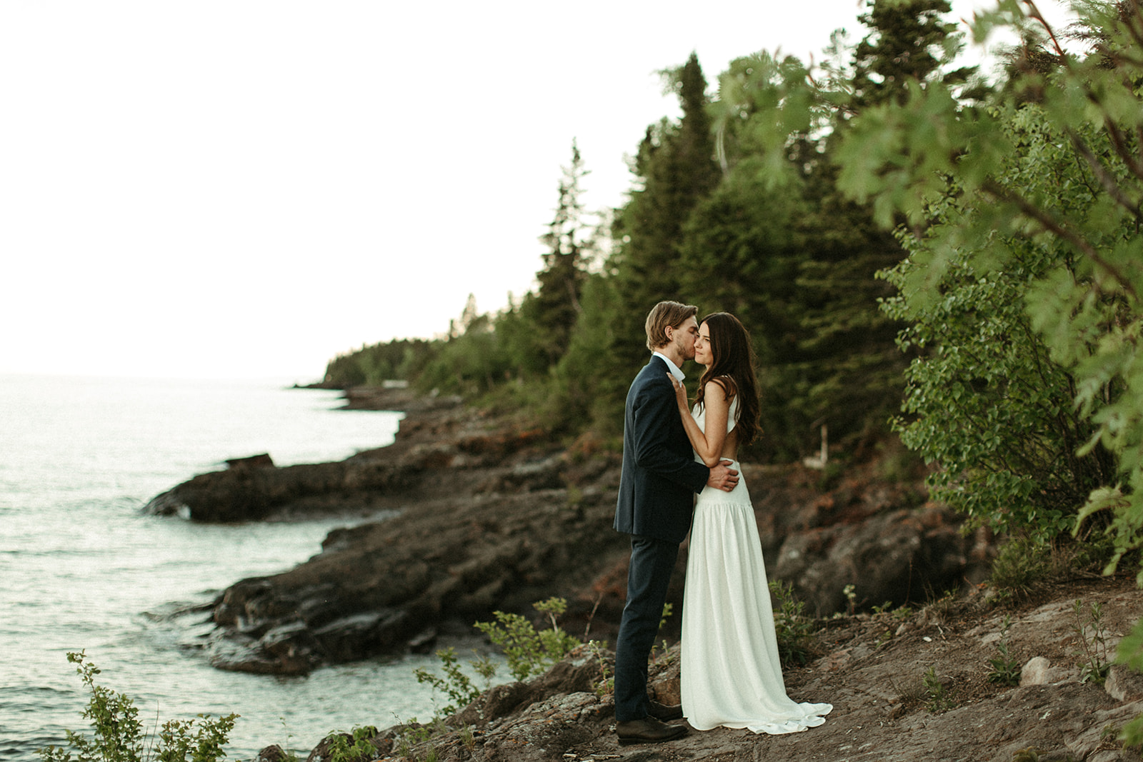 Couple embraces at wedding on Lake Superior
