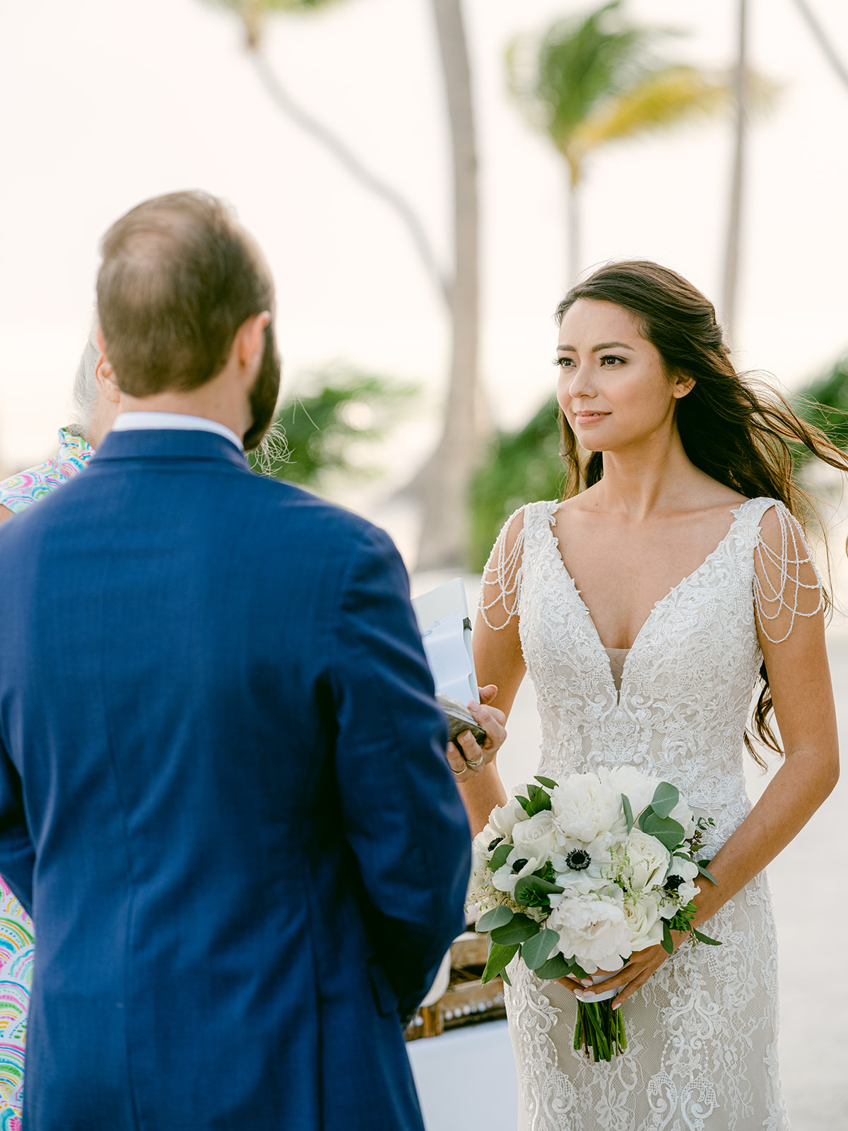 WEDDING COUPLE HAVE A BEACH FRONT CEREMOY IN ISLAMORADA FLORIDA CHEECA LODGE RESORT