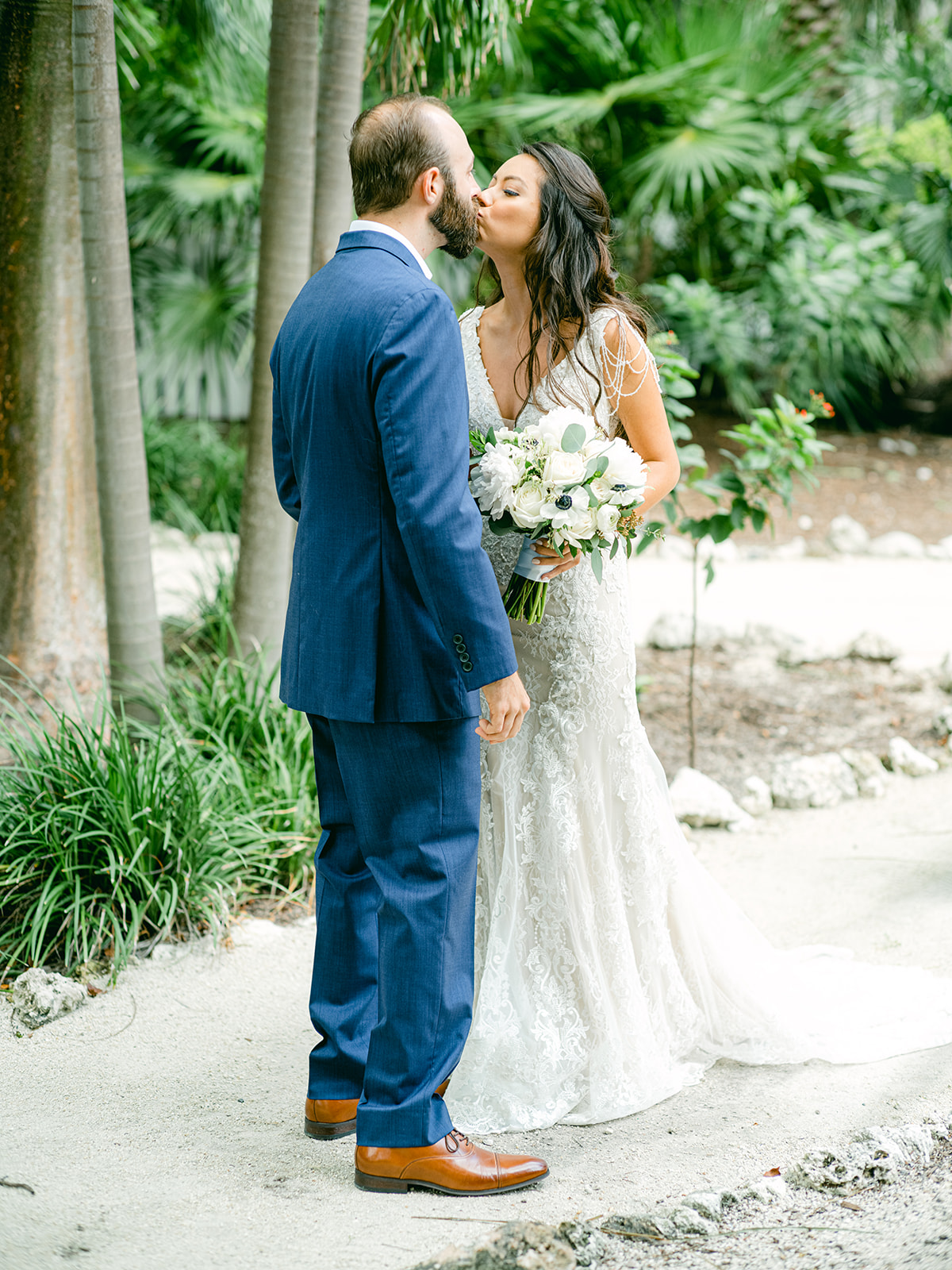WEDDING COUPLE HAVE A BEACH FRONT CEREMOY IN ISLAMORADA FLORIDA 