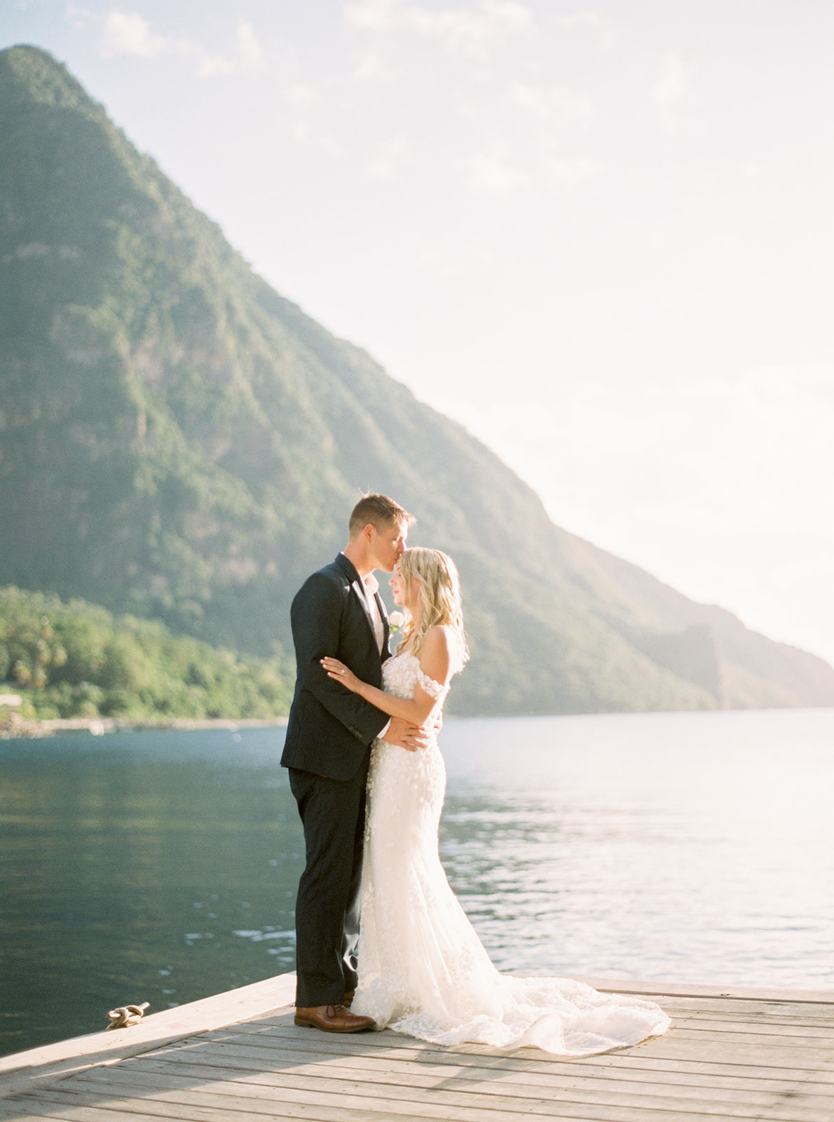 Bride and Groom embrace in front of the pitons at Sugar Beach after their St. Lucia wedding