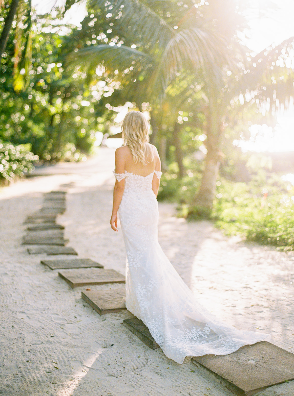Bride walking on the beach path at Sugar Beach St. Lucia