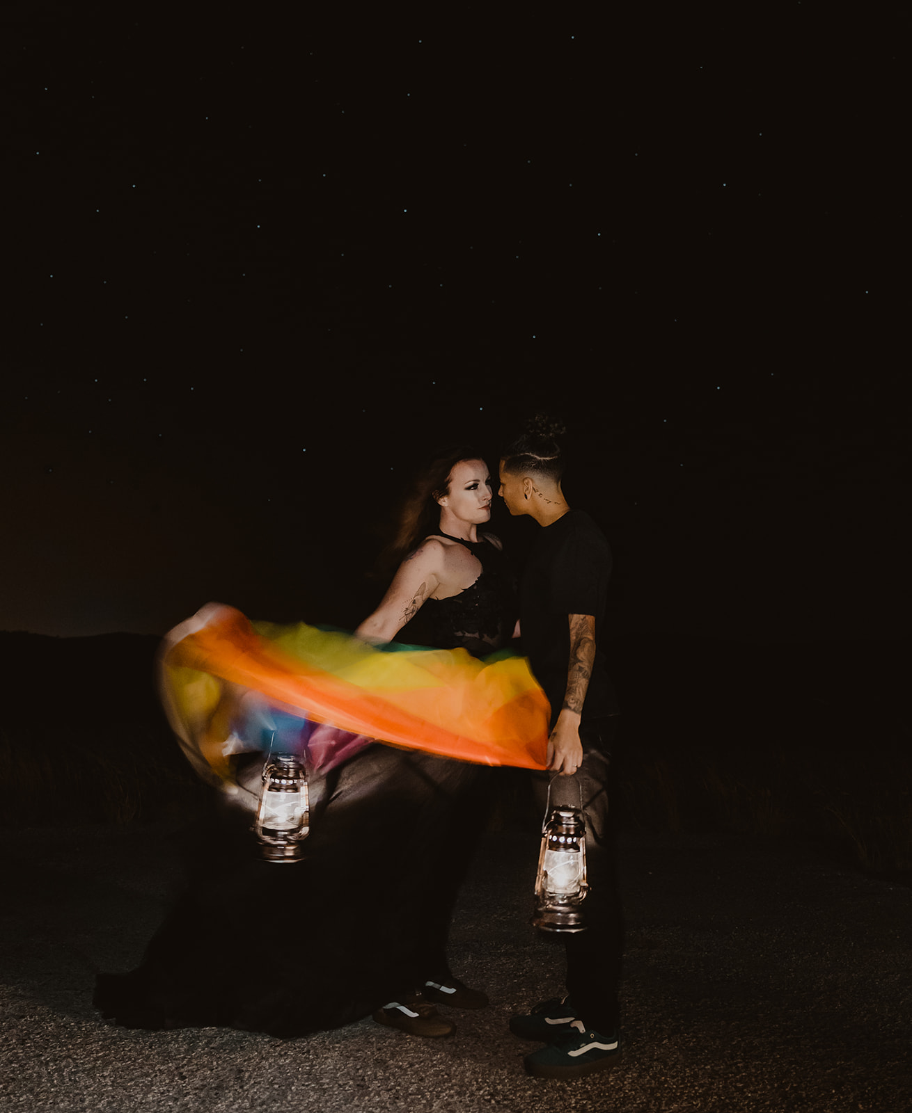 LGBTQIA+ elopement with rainbow flag and lanterns 