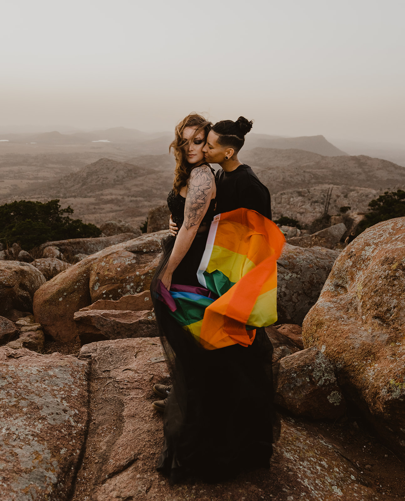 LGBTQIA+ elopement with rainbow flag 