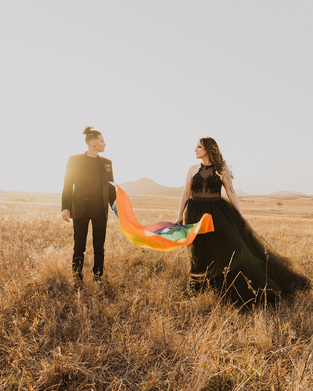 LGBTQIA+ elopement with rainbow flag 