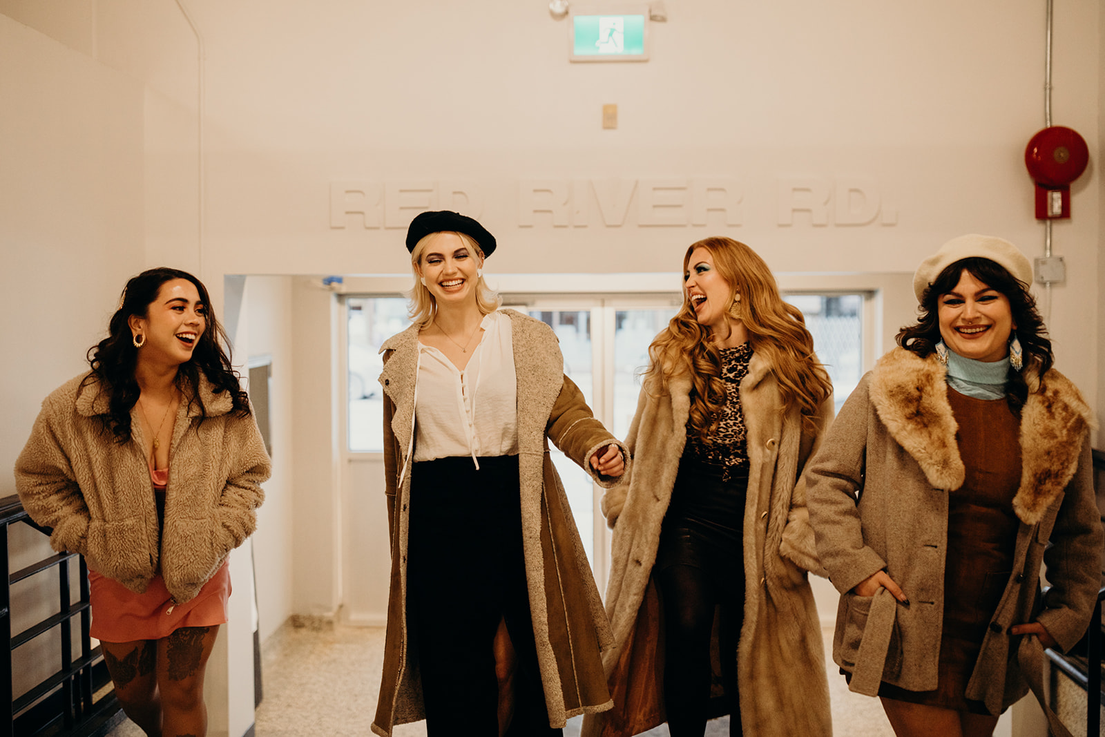 Group walks into Goods & Co. Market in Thunder Bay as part of their styled photoshoot for Woodside Bar. 