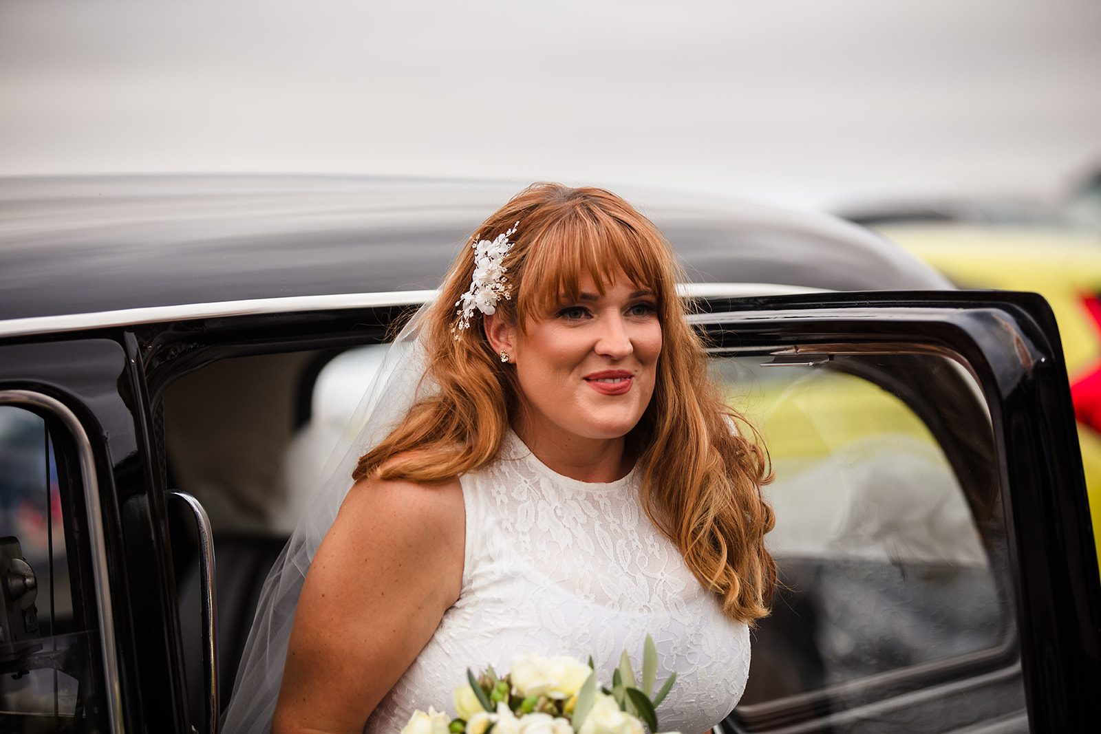 bride steps out of english taxi