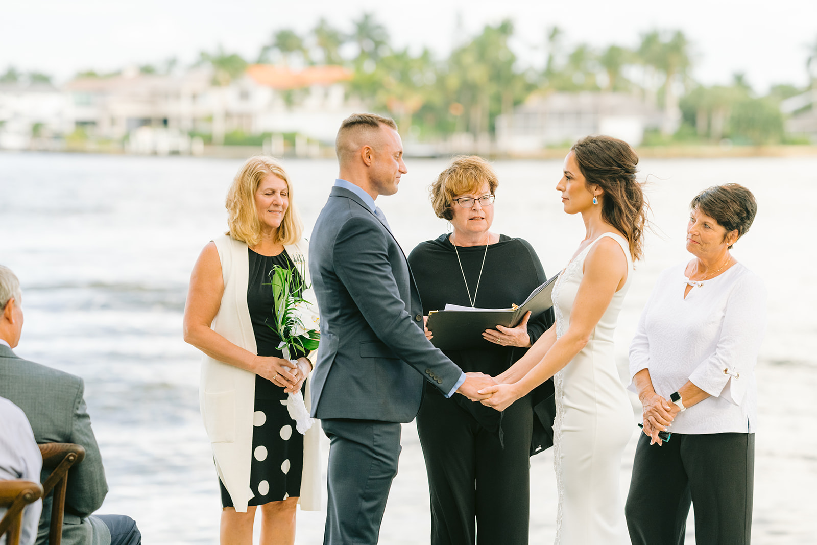 Naples FL wedding photographer captures the newlyweds walking down the aisle
