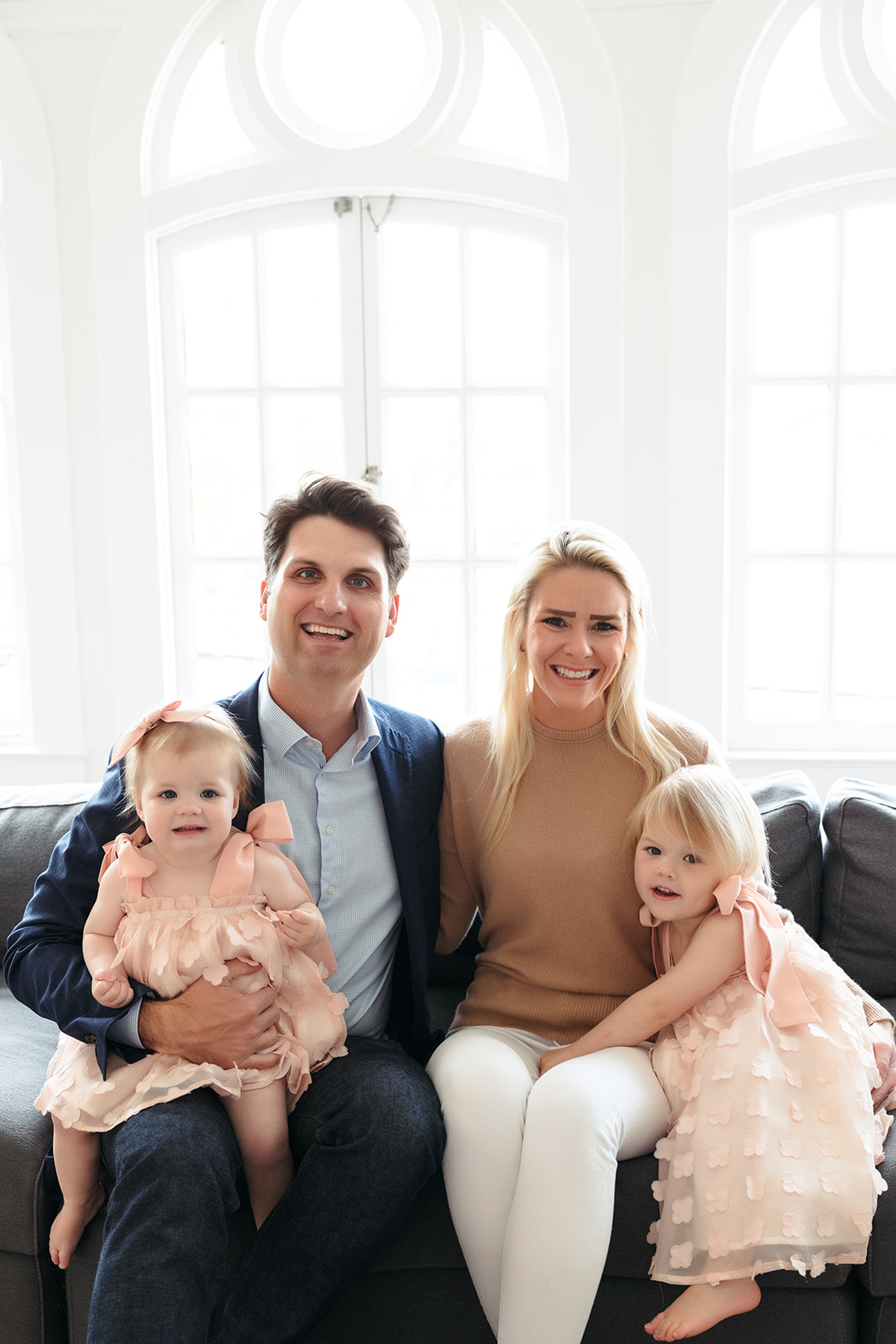A beautiful family of four with two daughters who did a photoshoot in their San Francisco home to celebrate a birthday.
