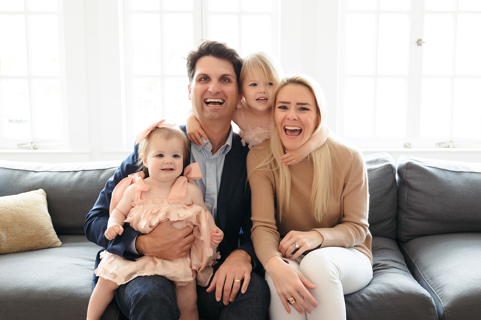 A beautiful family of four with two daughters who did a photoshoot in their San Francisco home to celebrate a birthday.