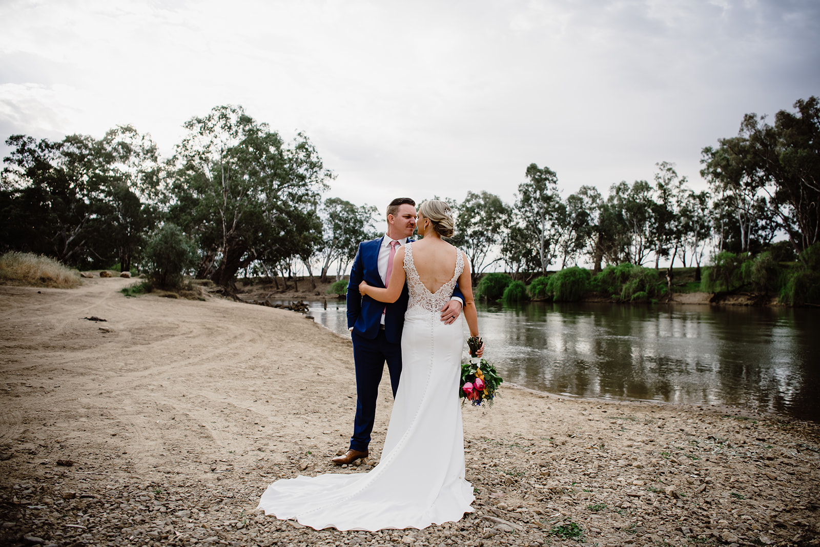 Bride and groom photo by the lake at Wagga Wagga Country Club. Wedding photo by the lake at Wagga Country Club.