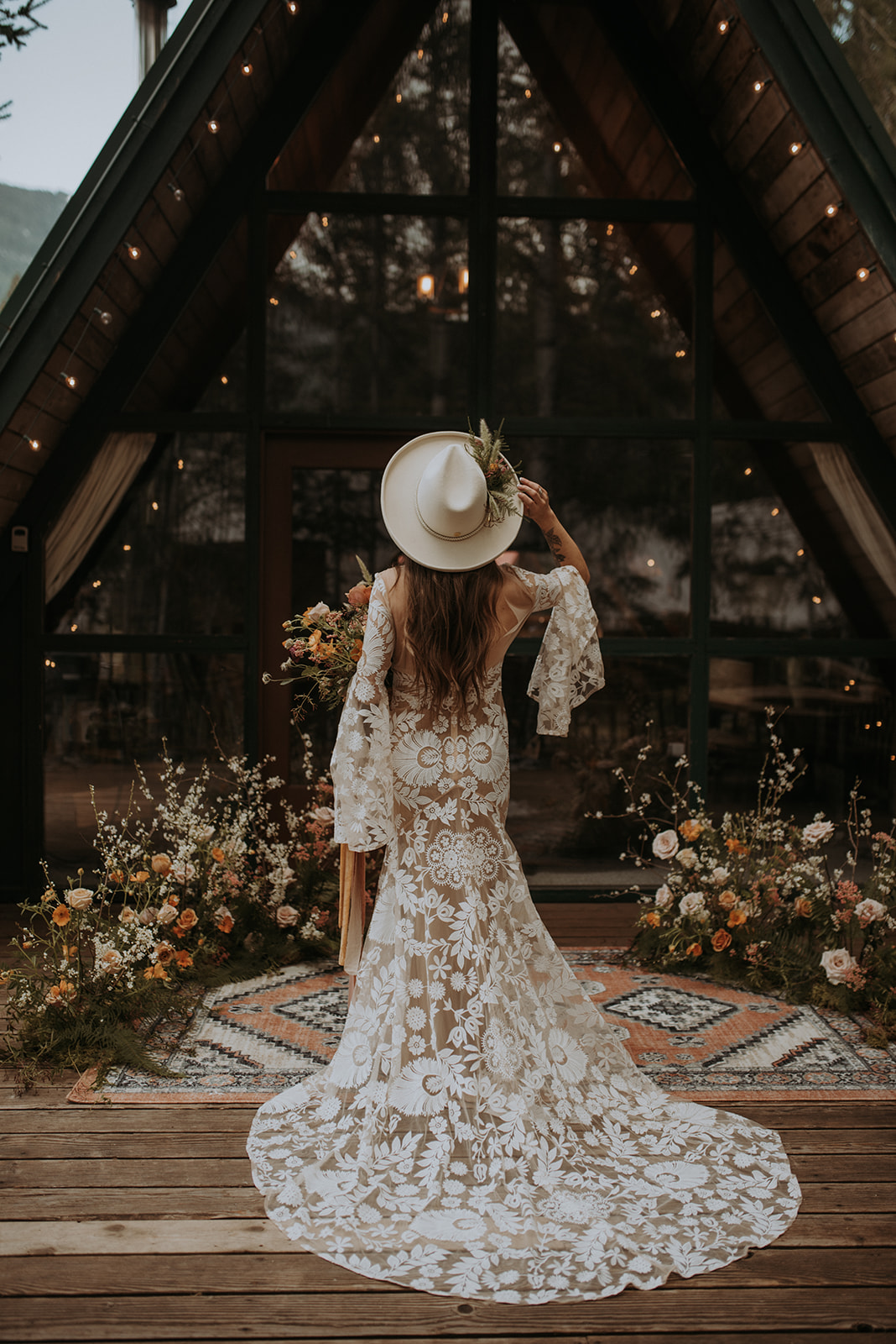 Mount Rainier elopement photographer captures intimate moment at cozy a-frame cabin, Woodsy wedding details, boho bride