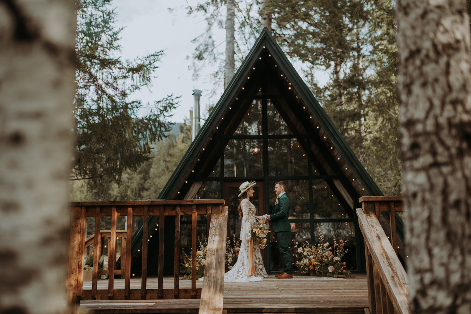 Mount Rainier elopement photographer captures intimate moment at cozy a-frame cabin, Woodsy wedding details, first look