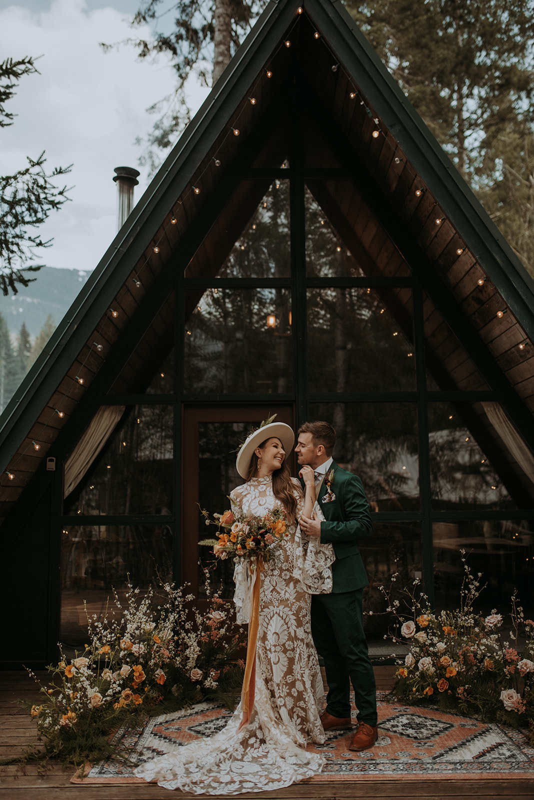Mount Rainier elopement photographer captures intimate moment at cozy a-frame cabin, Woodsy wedding details, first look