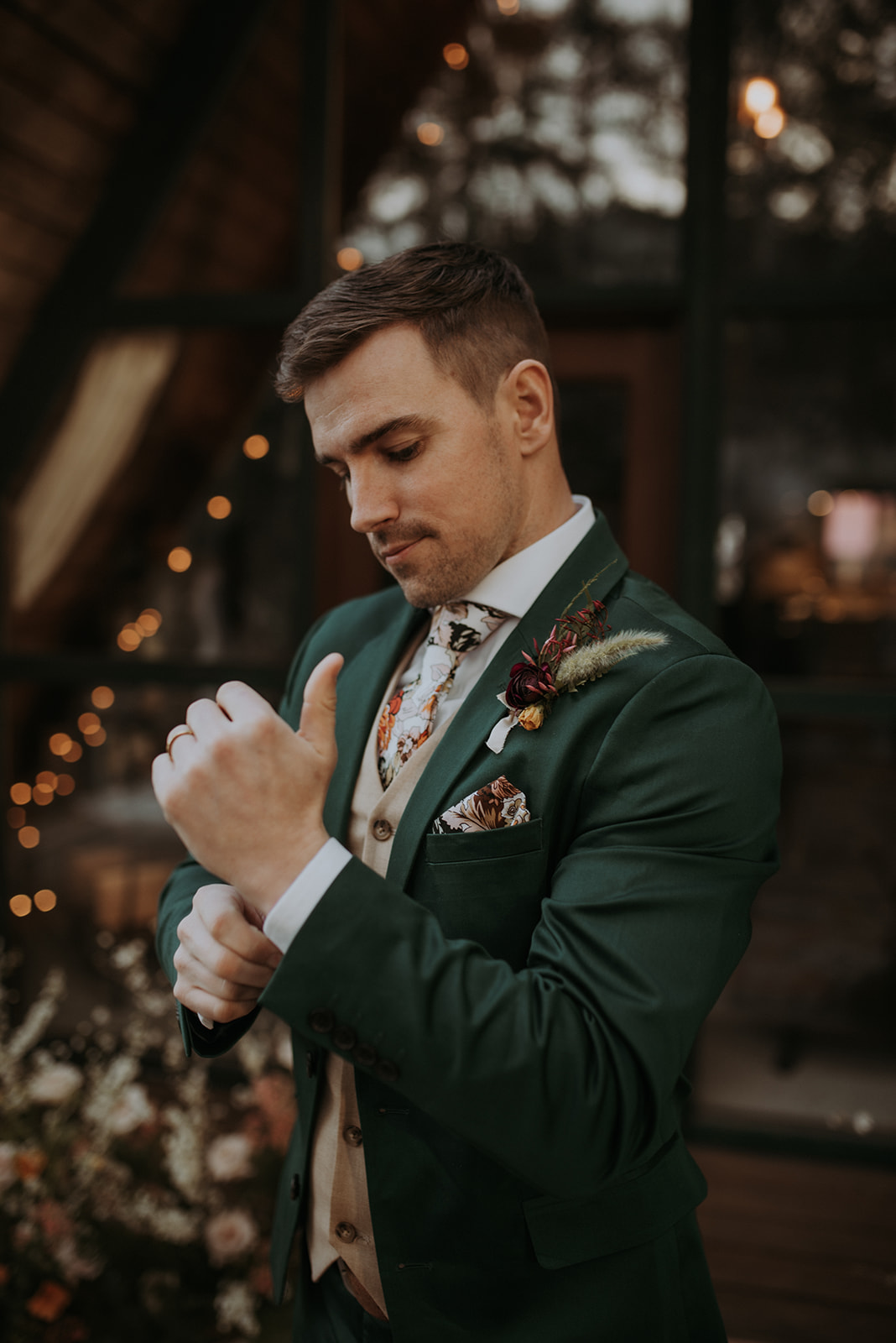 Mount Rainier elopement photographer captures intimate moment at cozy a-frame cabin, Woodsy wedding details, groom photo