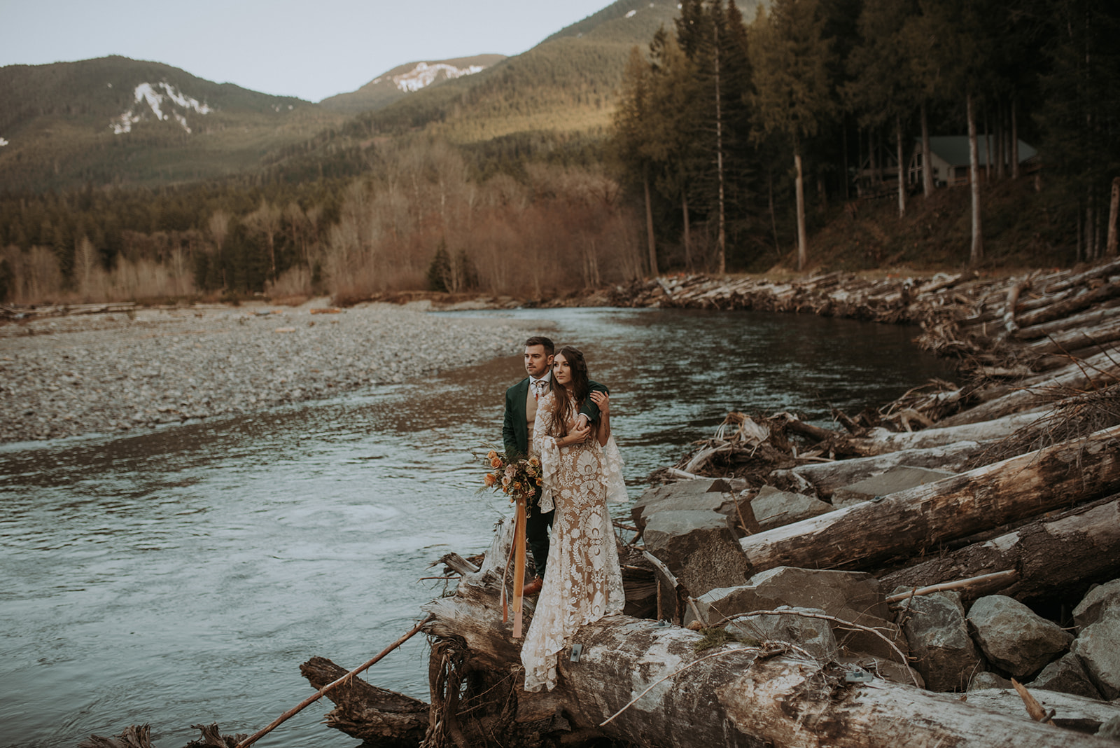 Mount Rainier elopement photographer captures intimate moment at cozy a-frame cabin, Woodsy wedding, river wedding photo