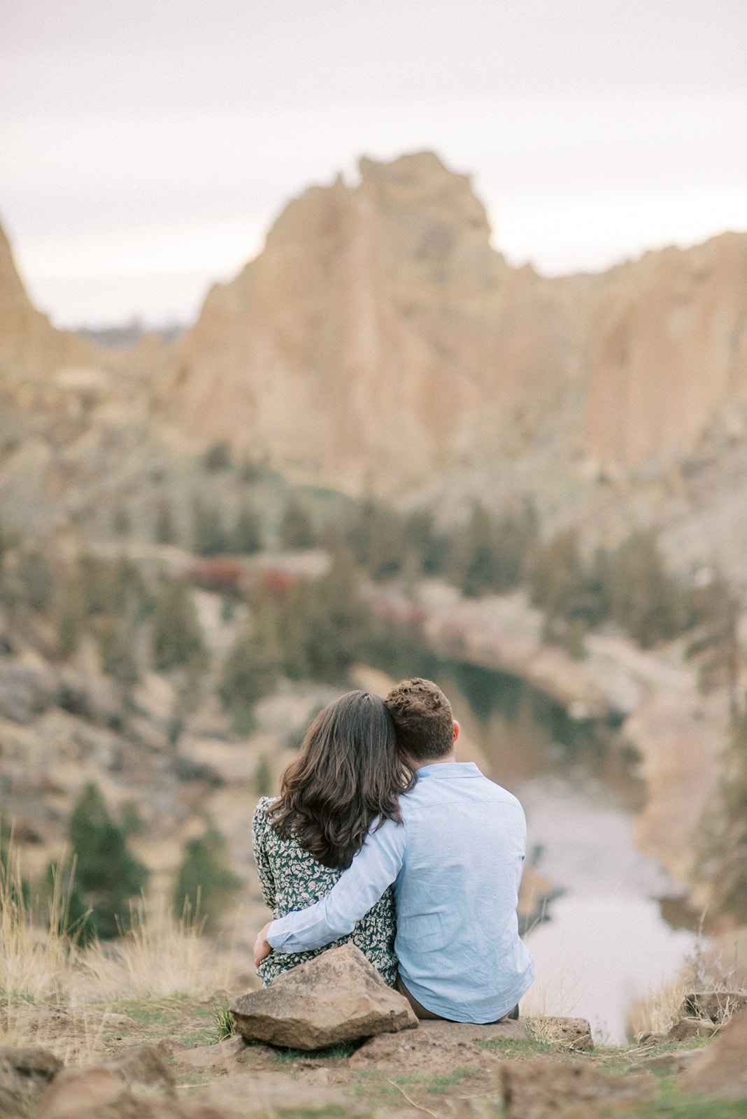 A couple looks out at the view of Smith Rock State Park in Oregon