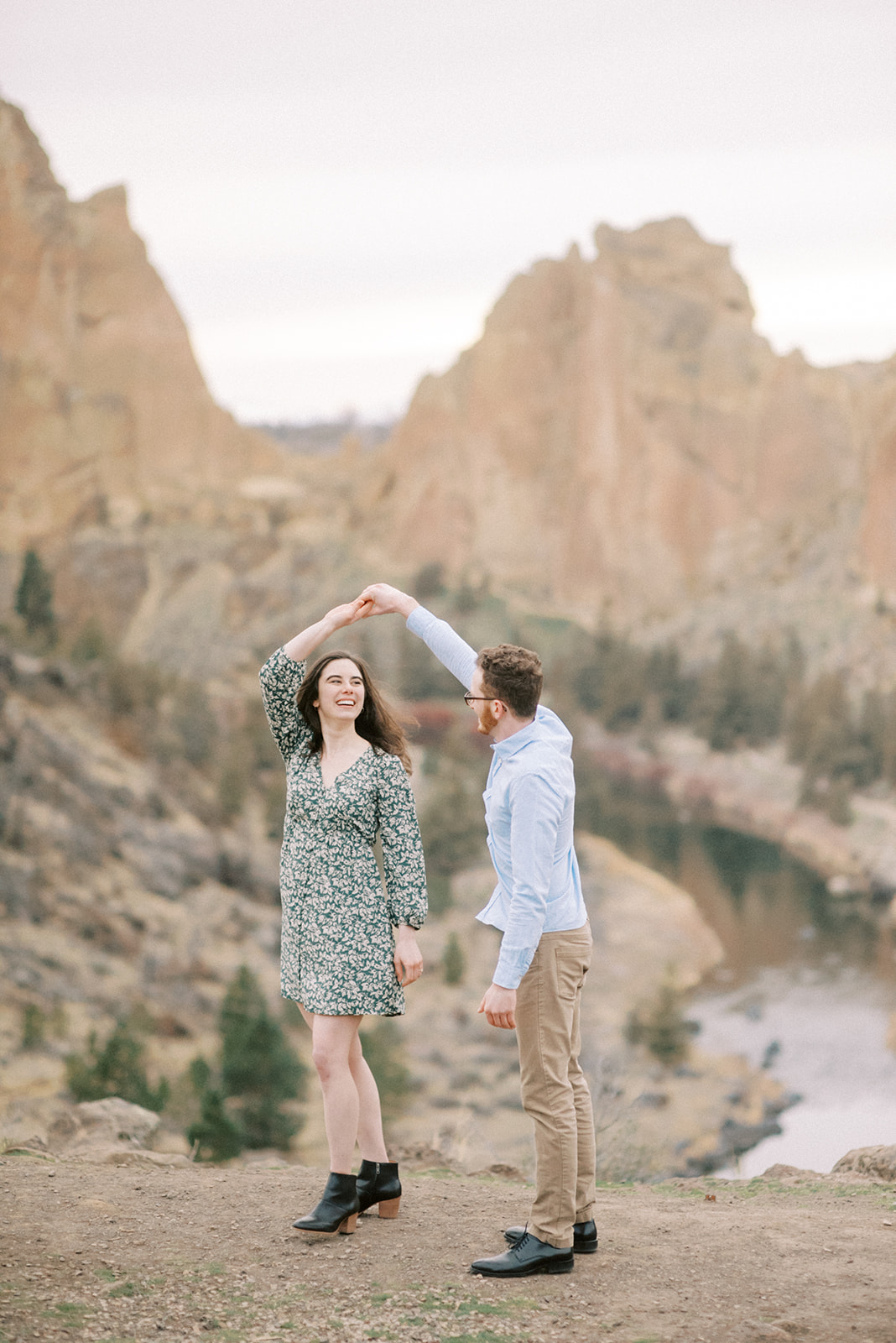 a couple dances in front of Smith Rock