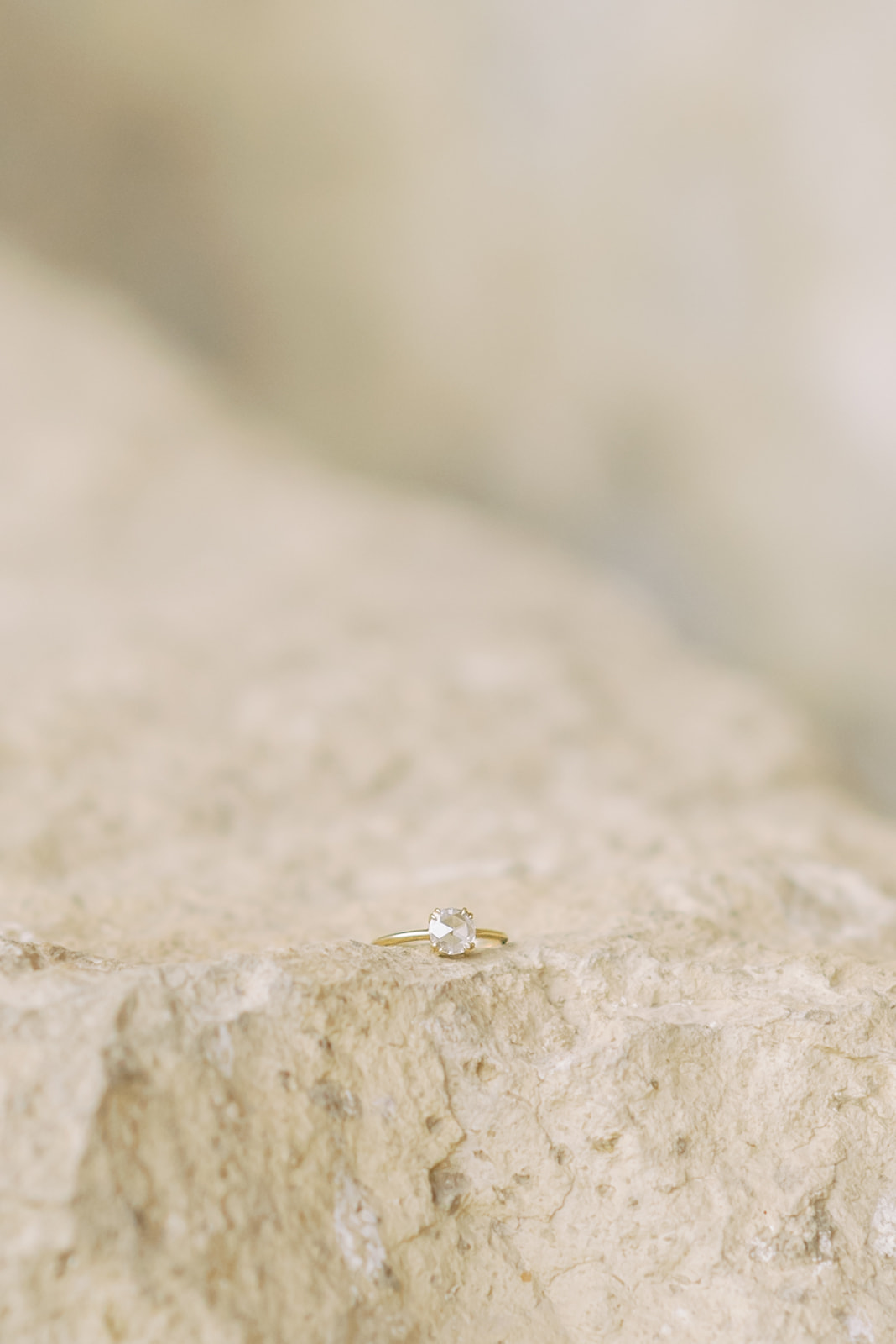 an engagement ring photographed on a rock in Bend, Oregon