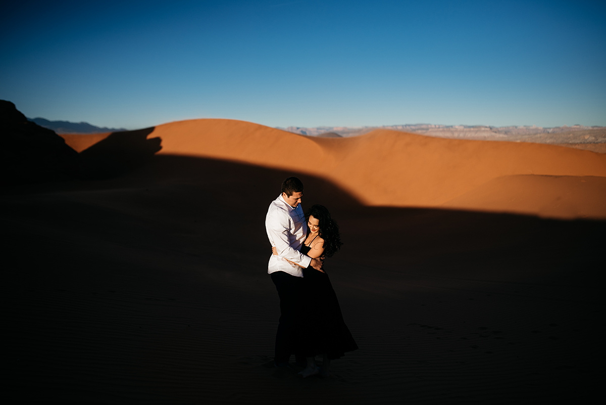 Under Utah's vast sky, a couple's love story unfolds in the red dunes, each shot echoing with emotion