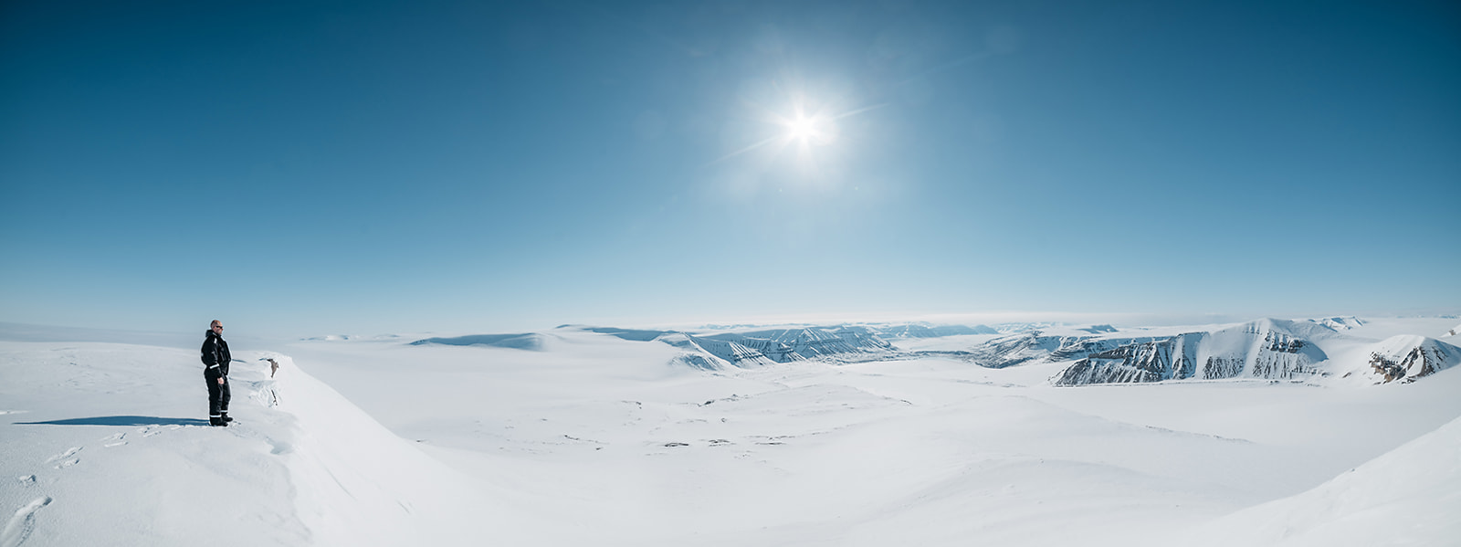 snow covered mountain range on a bright day on Svalbard